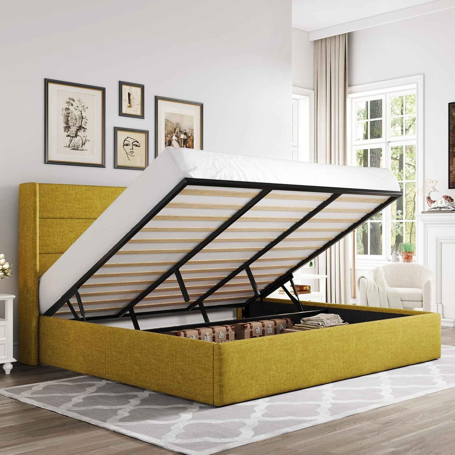 Yellow upholstered storage bed with mattress lifted to show interior storage in a bright bedroom.