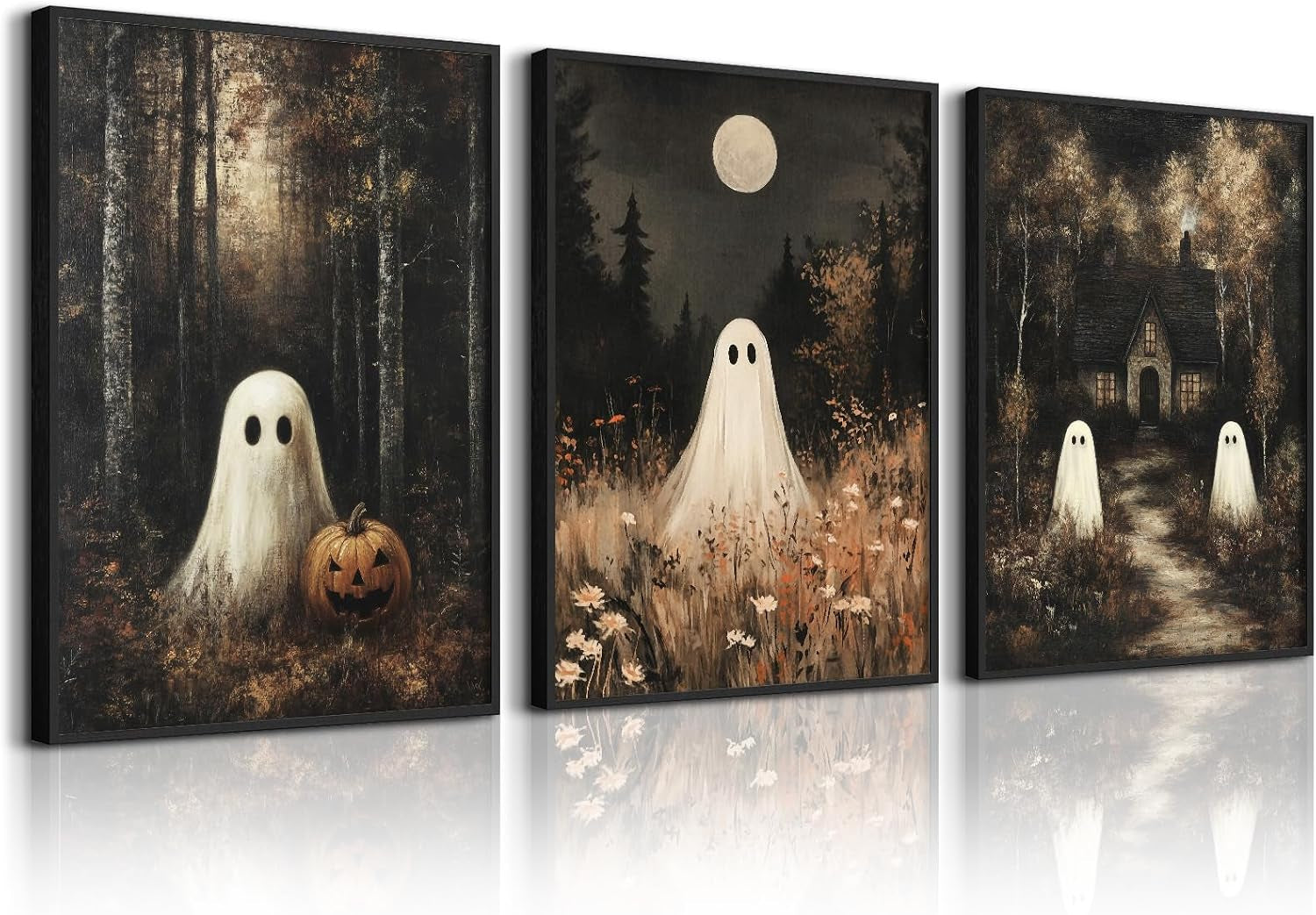 Three vertical framed canvases showing ghost figures in dark forest scenes, one with a jack-o'-lantern.