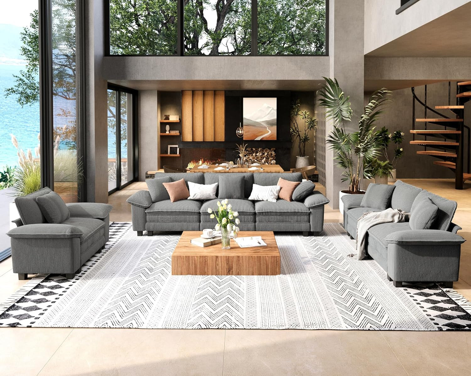 Wide living room view with a three-seat sofa, loveseat and armchair in gray fabric around a low wooden coffee table.