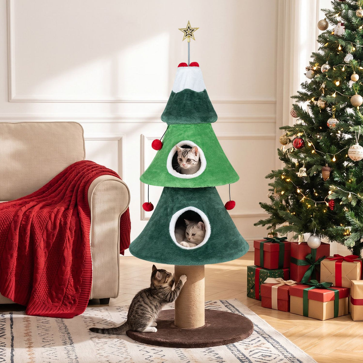 Green Christmas tree-shaped cat tower beside a sofa and lit Christmas tree, with two cats in the openings and one at the