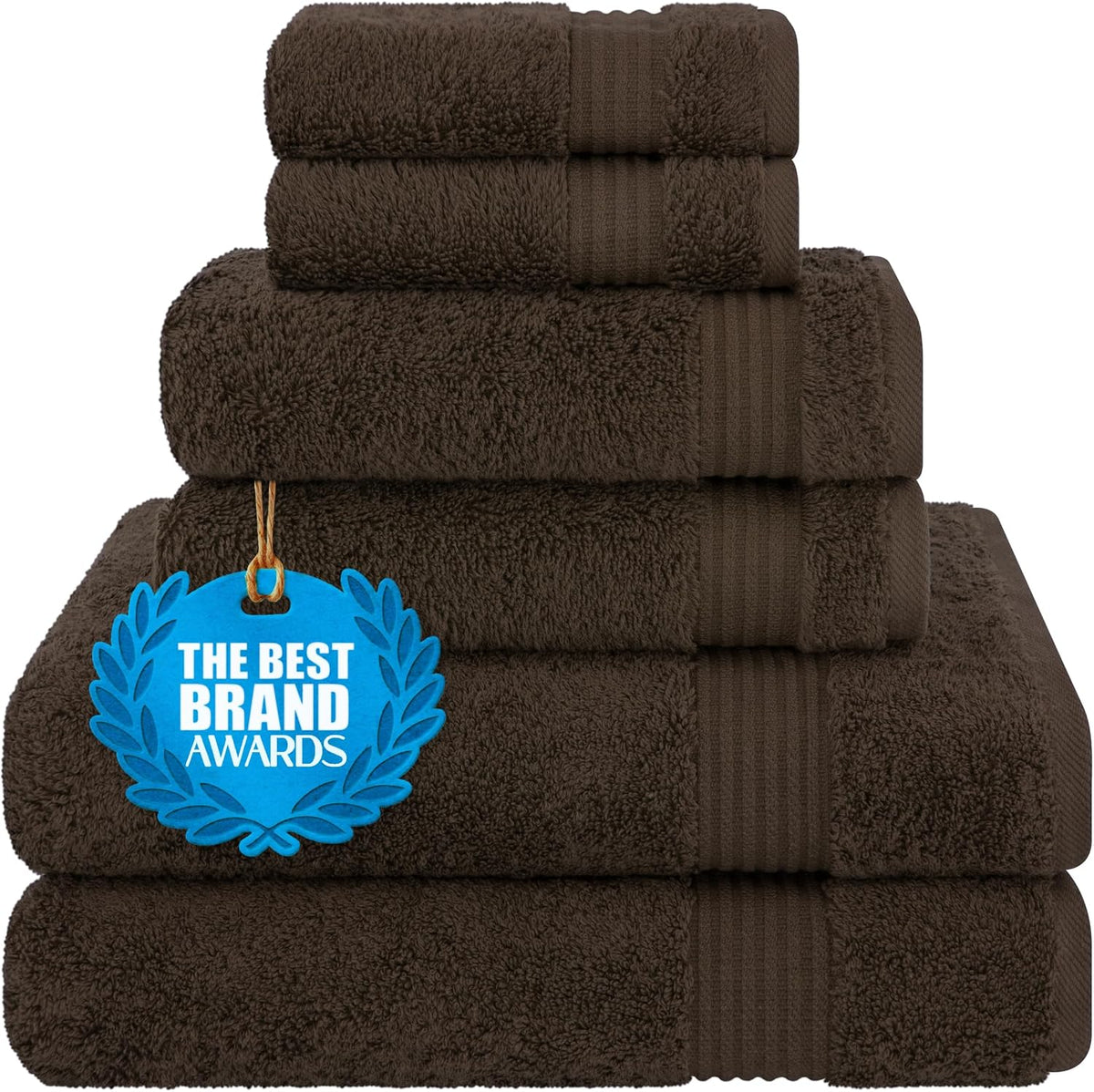 Neatly stacked dark brown towels with an attached blue award tag on a white background.