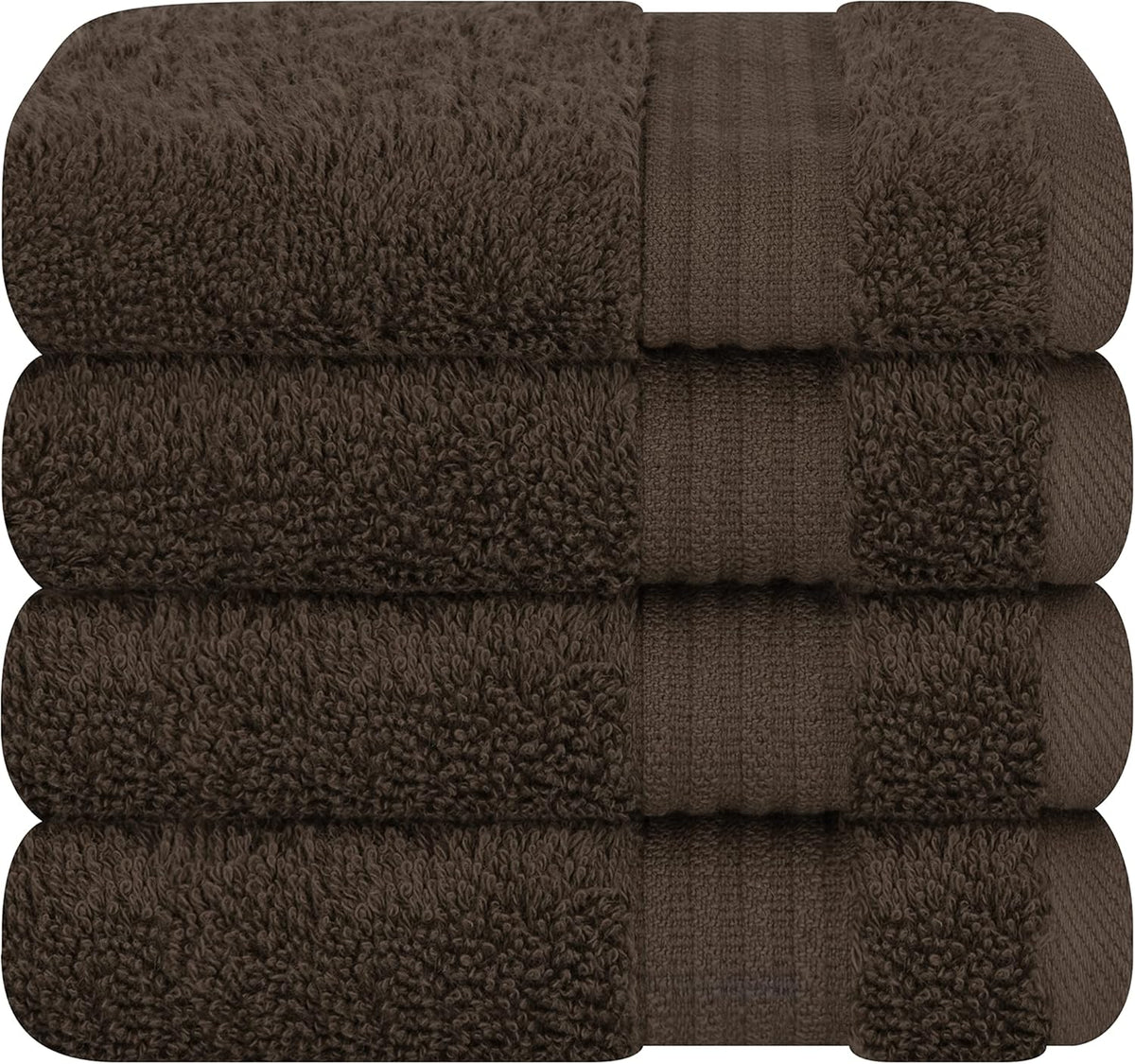 Stack of four plush dark brown towels folded with ribbed bands visible on the edges.