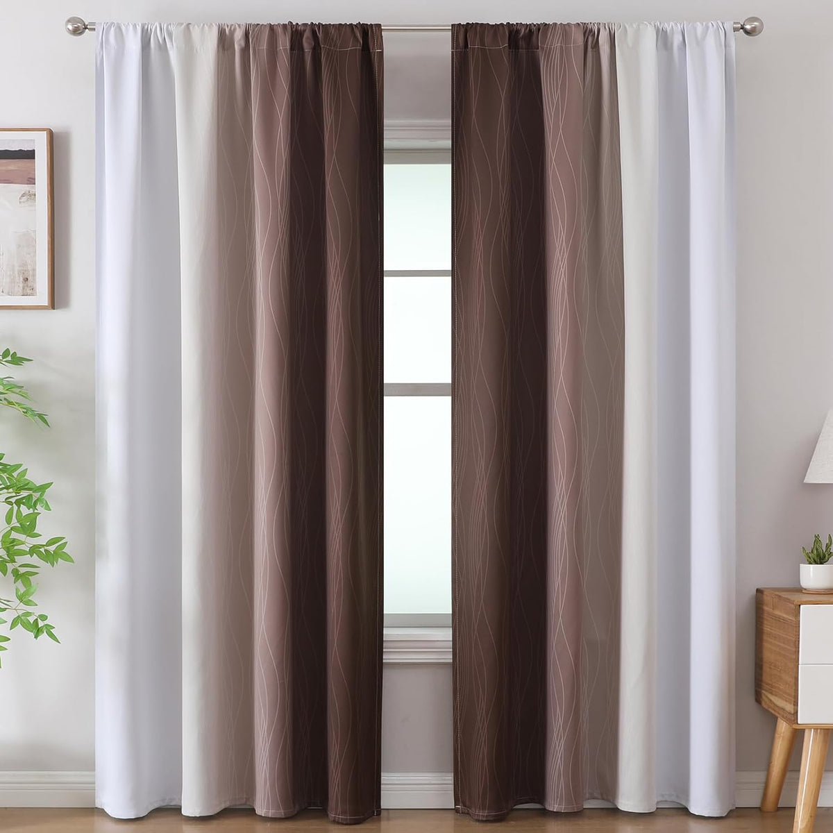 Pair of ombre blackout curtain panels hung with gathered rod-pocket top, full-length drape in a living room setting