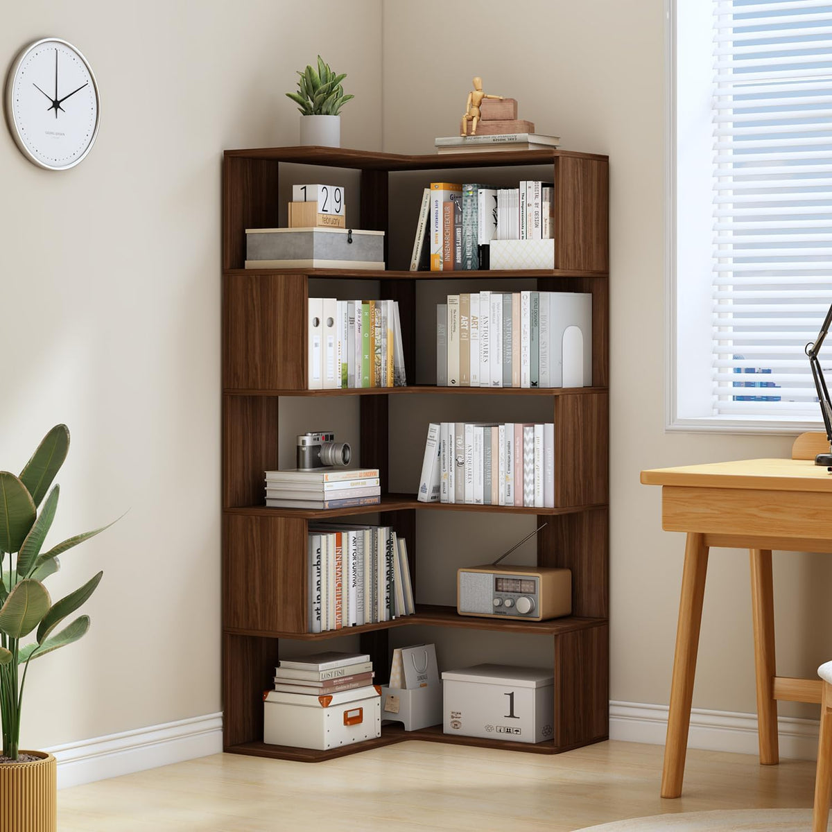 Walnut corner bookshelf staged in a study setting next to a desk and window, front view