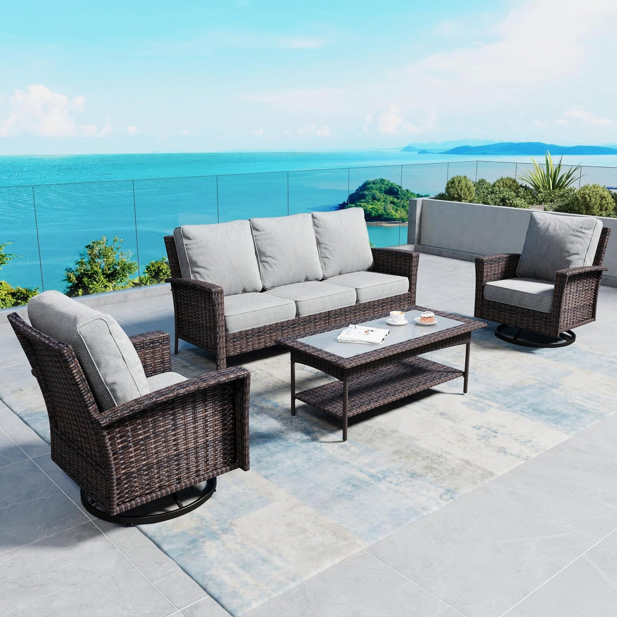 Outdoor patio set with three-seat sofa, two swivel chairs and rectangular coffee table on a terrace.
