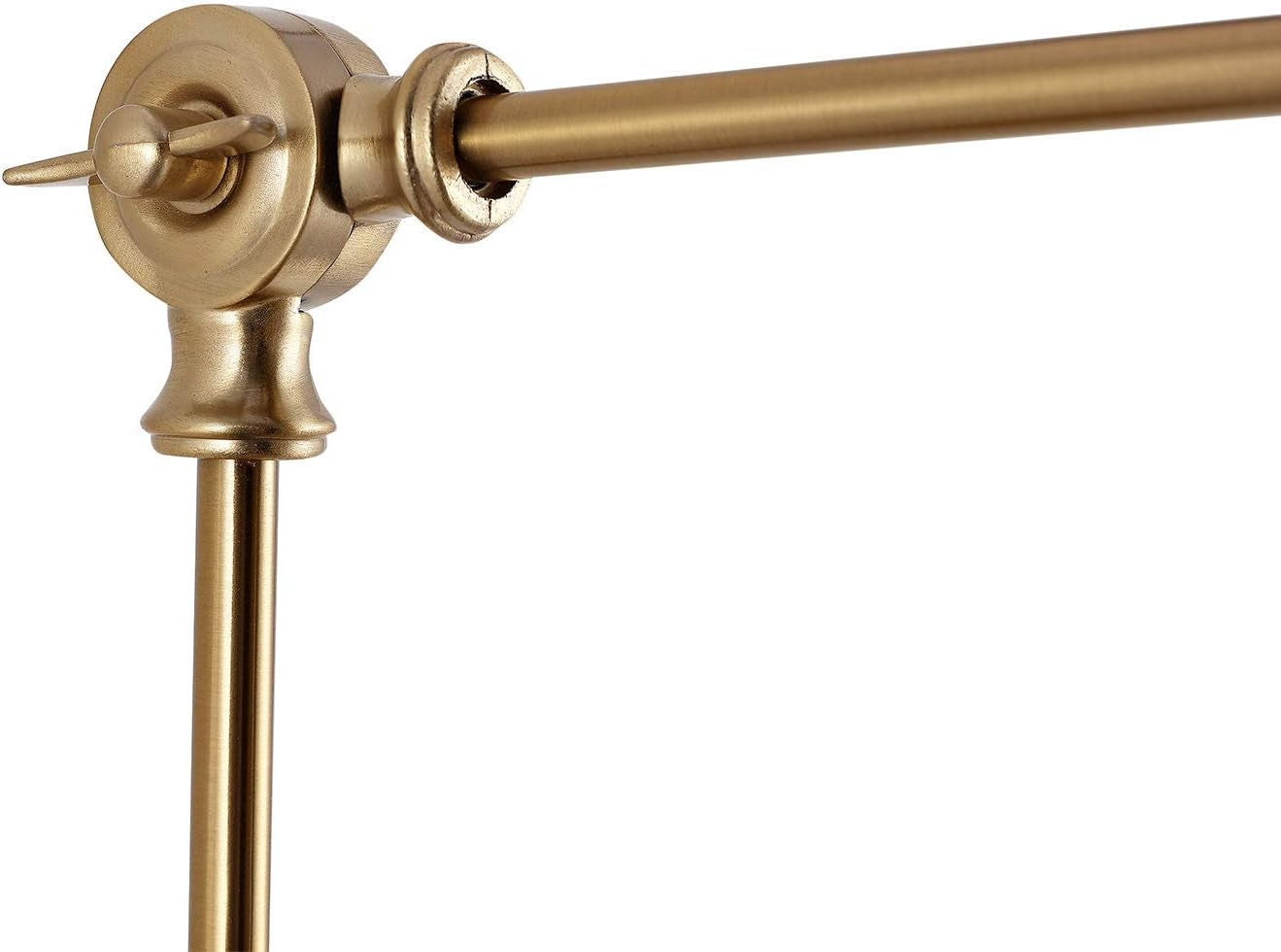 Tight close-up of the sconce's brass swivel joint and round wall arm showing hardware detail.