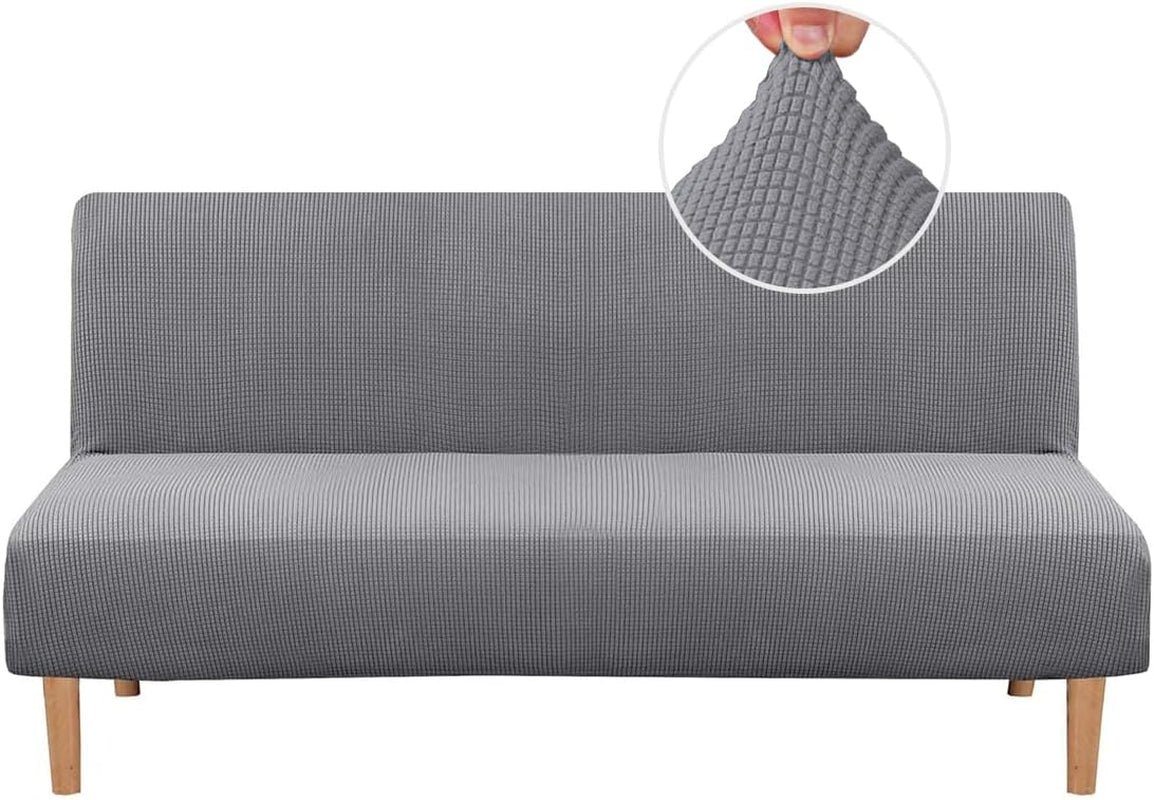 Front view of a gray small-check textured slipcover stretched over an armless futon with wooden legs.