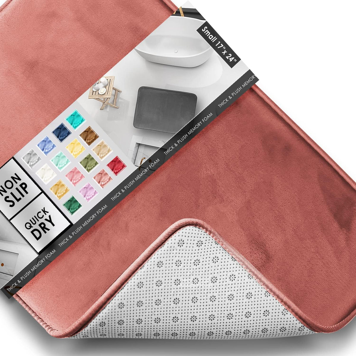 Tight view of a coral-pink mat corner flipped to reveal the patterned non-slip backing and stitched edge