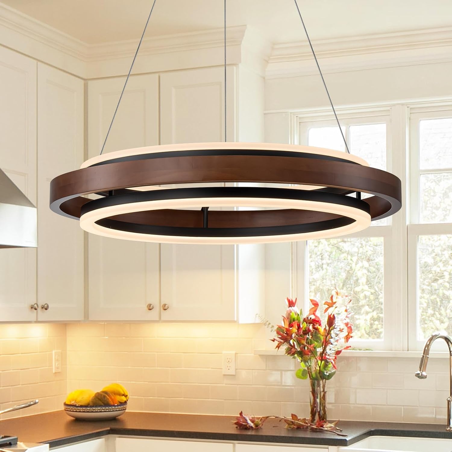 Walnut-color two-ring LED round chandelier close-up suspended over a kitchen countertop
