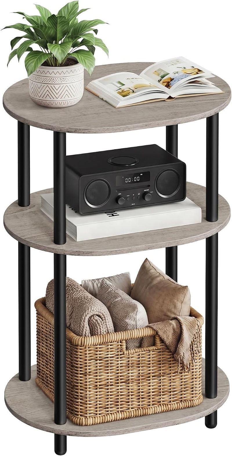 Three-tier round side table with gray wood shelves and black cylindrical legs, styled with a plant, radio, book and woven