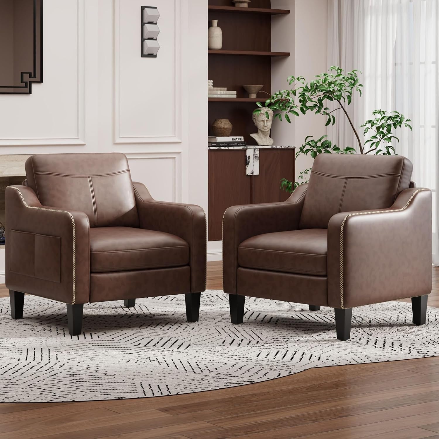 Two chocolate brown PU leather accent chairs with stitched armrests shown in a living room setting