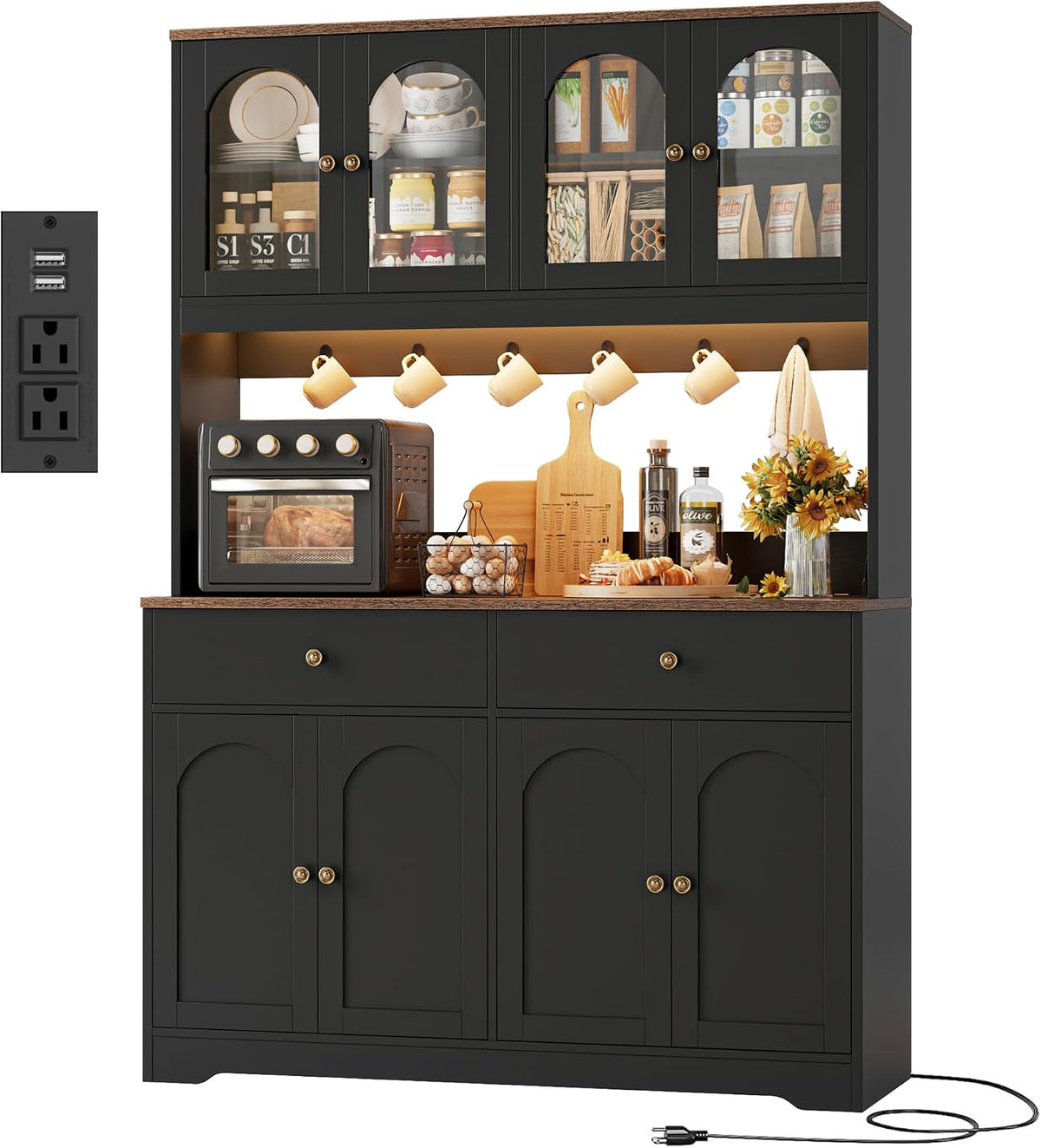 Upper hutch close-up showing glass doors, interior shelving with pantry items and inset power/USB outlet panel