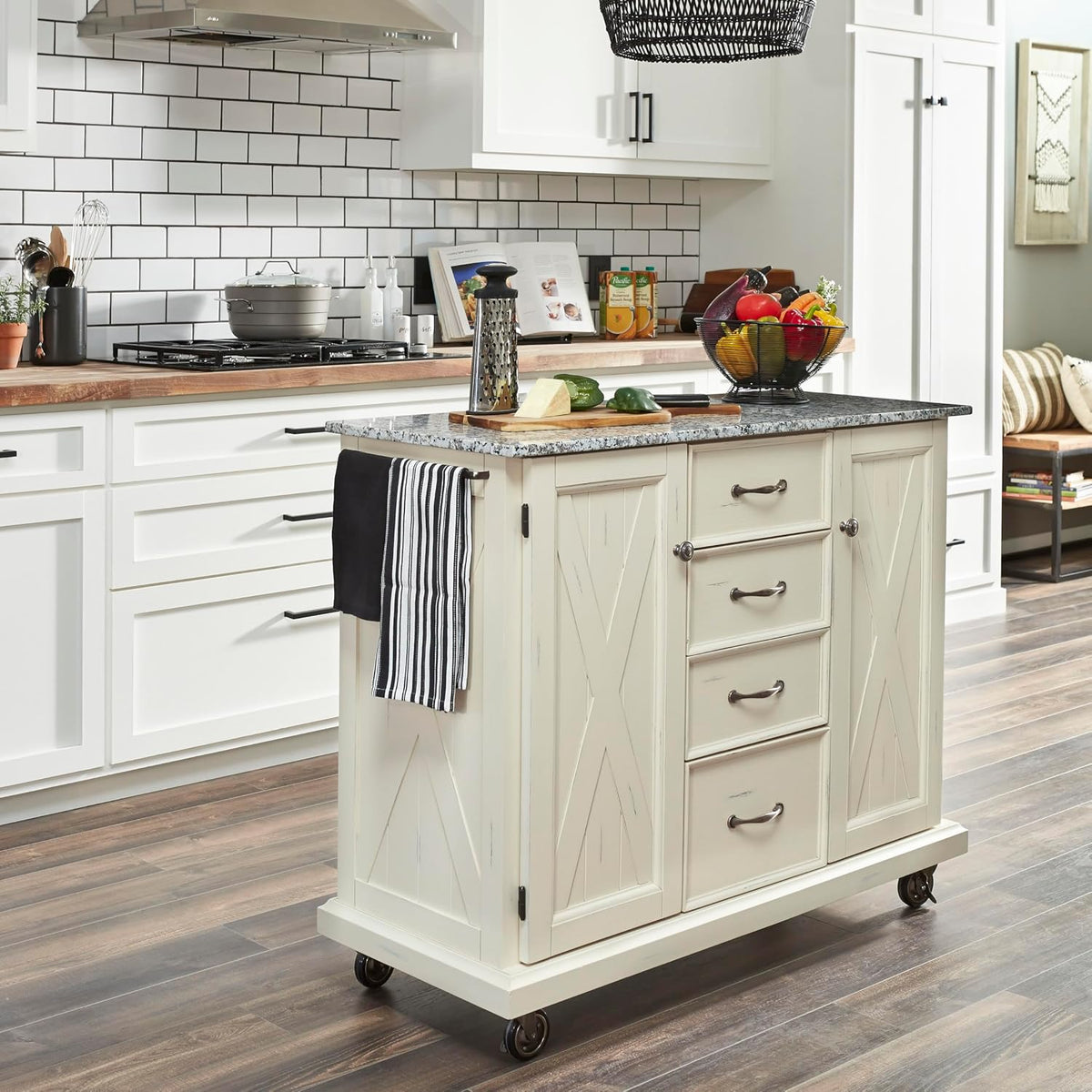 Angled kitchen scene with off-white cart and granite top, towel bar visible on the side in a styled kitchen setting