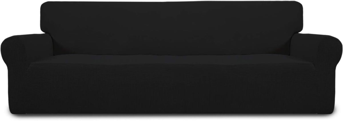 Front-on studio shot of a black loveseat cover showing subtle ribbed texture and tucked arm seams.