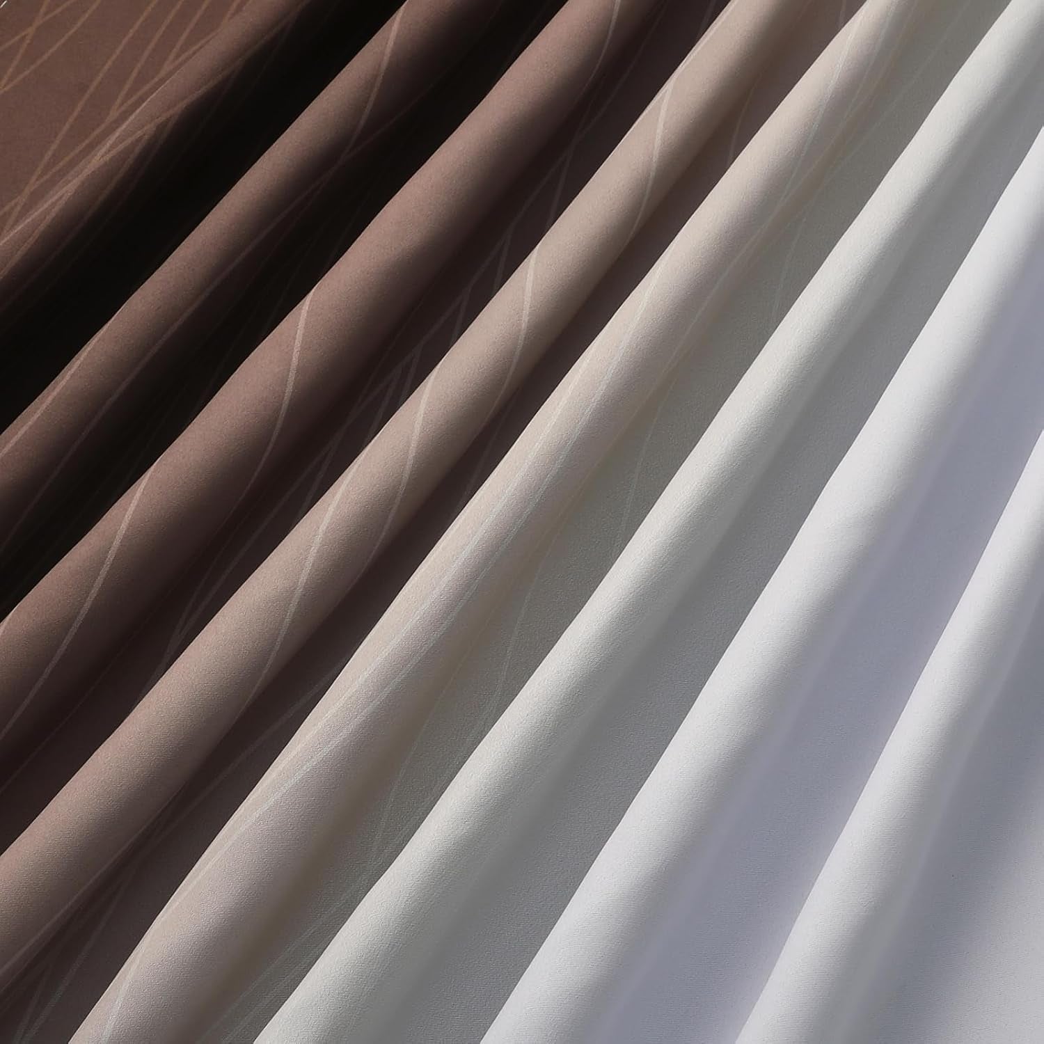 Draped panels showing a gradient from dark brown to light grey to white with subtle linear pattern