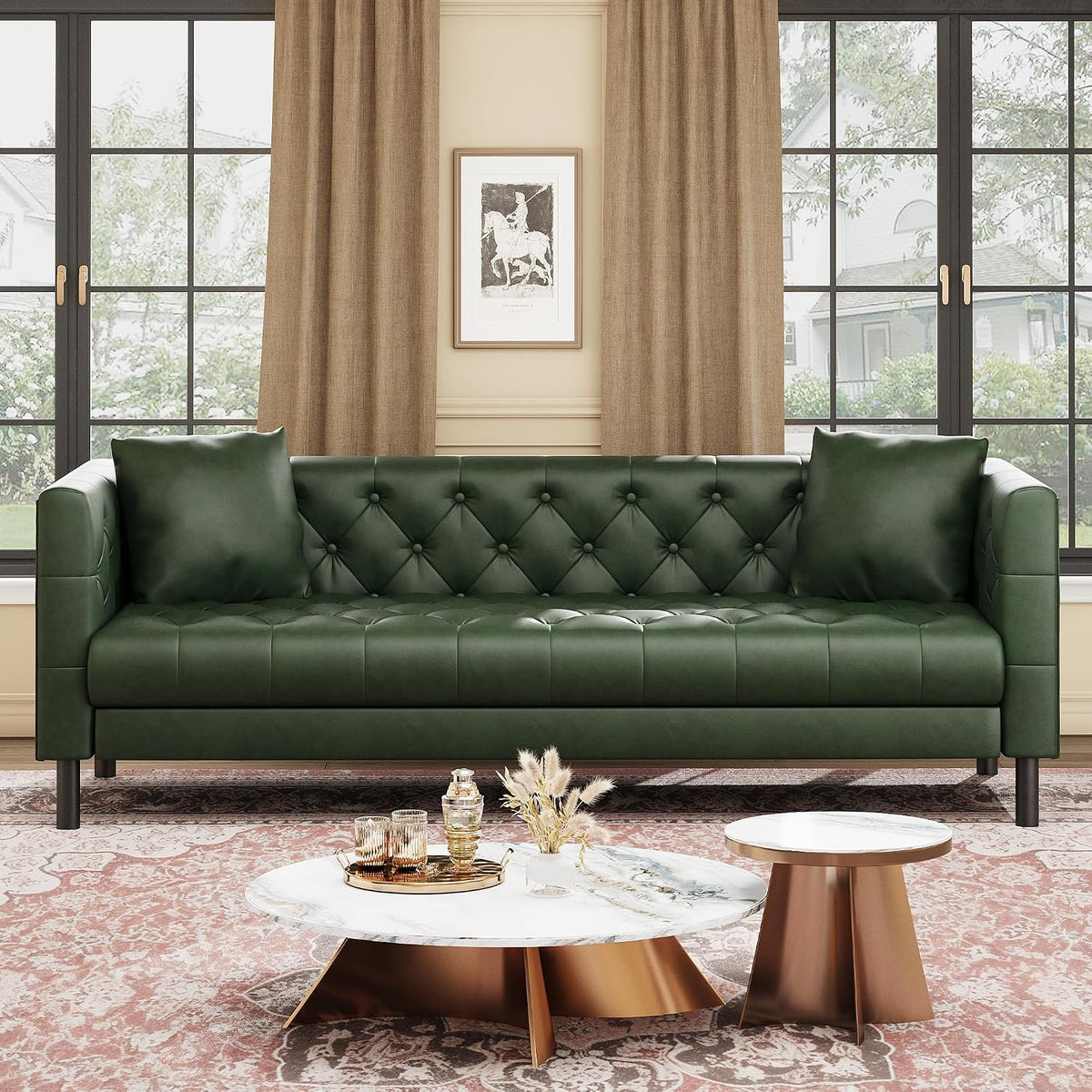 Front view of a deep green tufted three-seat sofa with two square pillows in a sunlit living room.