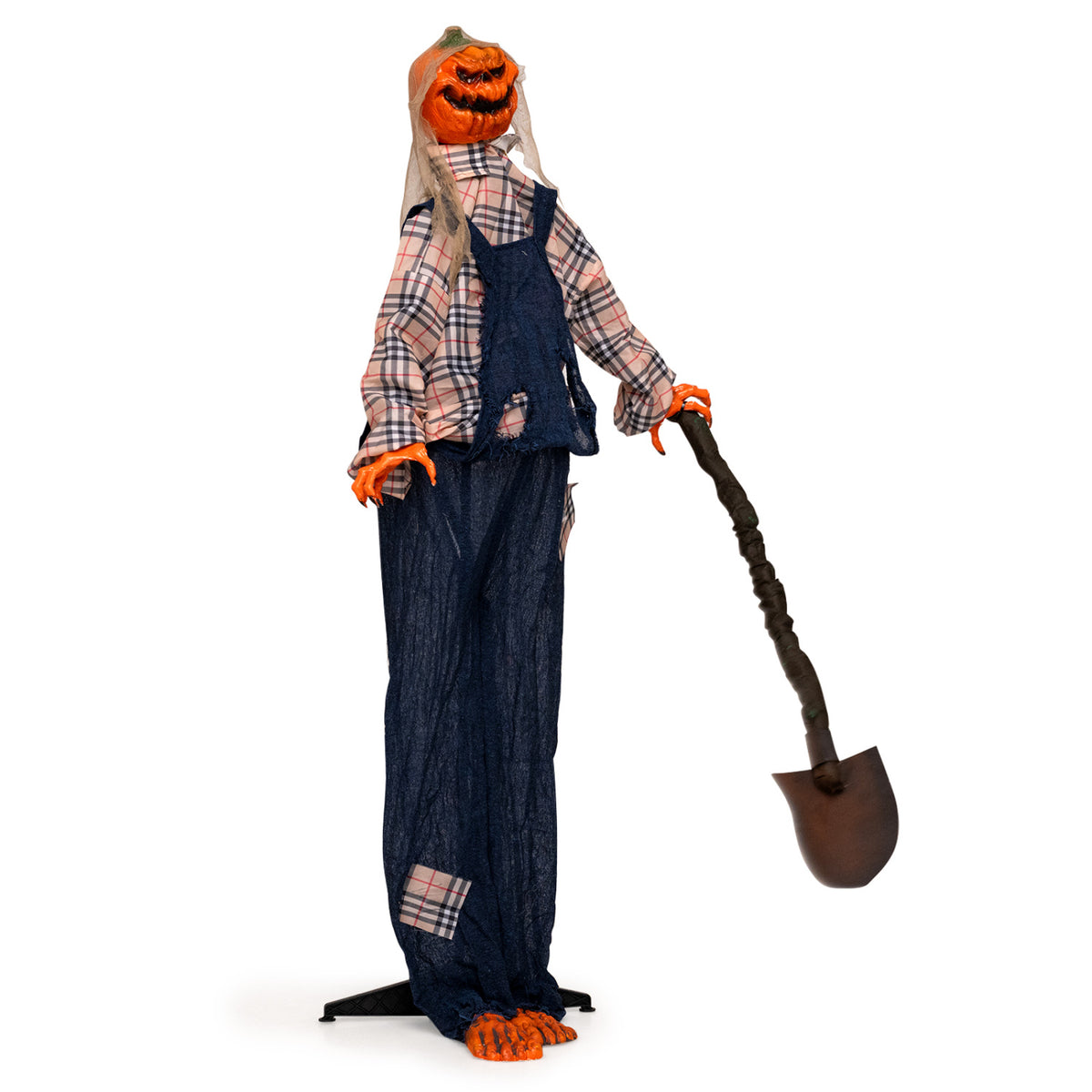 A pumpkin-headed scarecrow holding a shovel is shown at an angle against a white background.