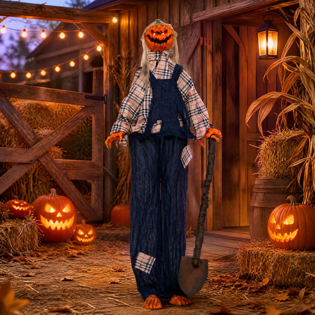 A pumpkin-headed scarecrow holding a shovel stands among hay bales and jack-o’-lanterns by a rustic barn.