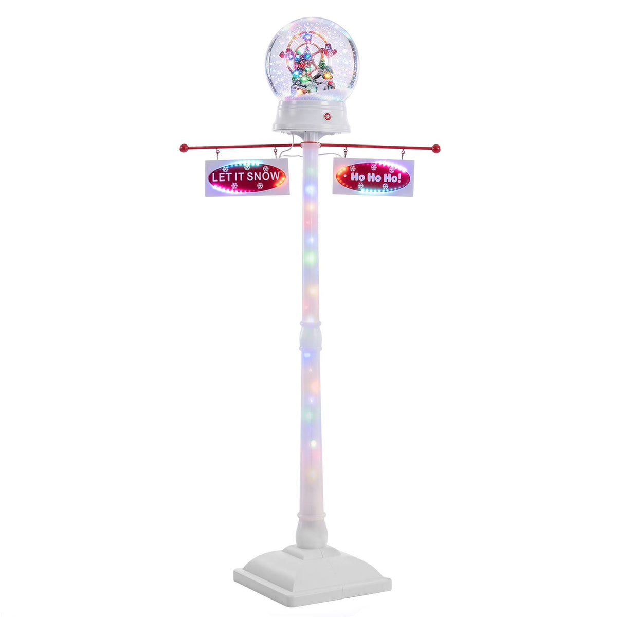 Full view of the white street lamp with a glowing globe, colorful lights along the post, and two hanging signs.