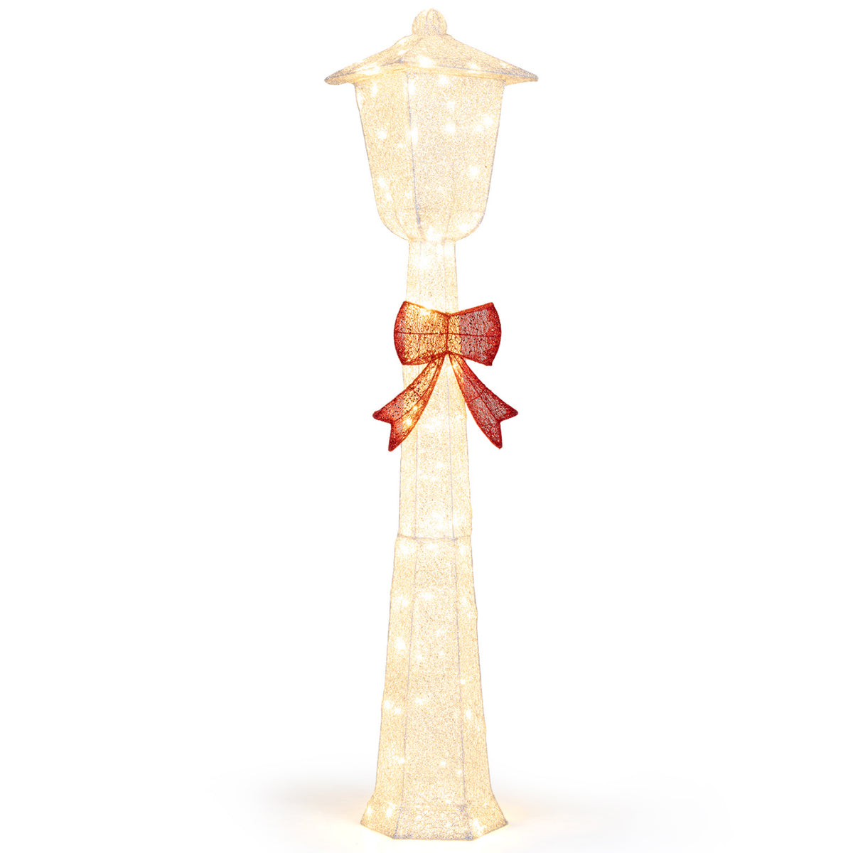 Lighted decorative lamp post with a red bow shown against a plain white background.