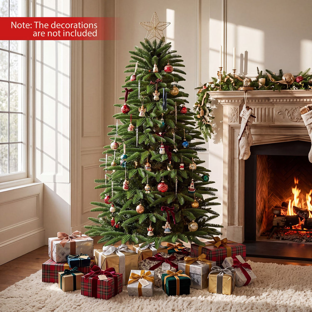 Decorated artificial Christmas tree with a star topper and wrapped gifts beside a lit fireplace.