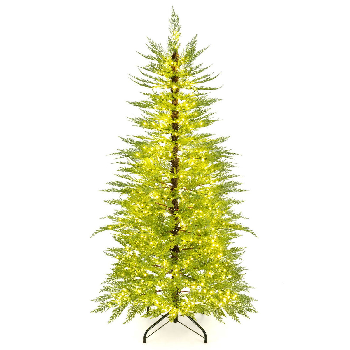 Slim artificial Christmas tree with warm lights on a dark metal stand against a white background.
