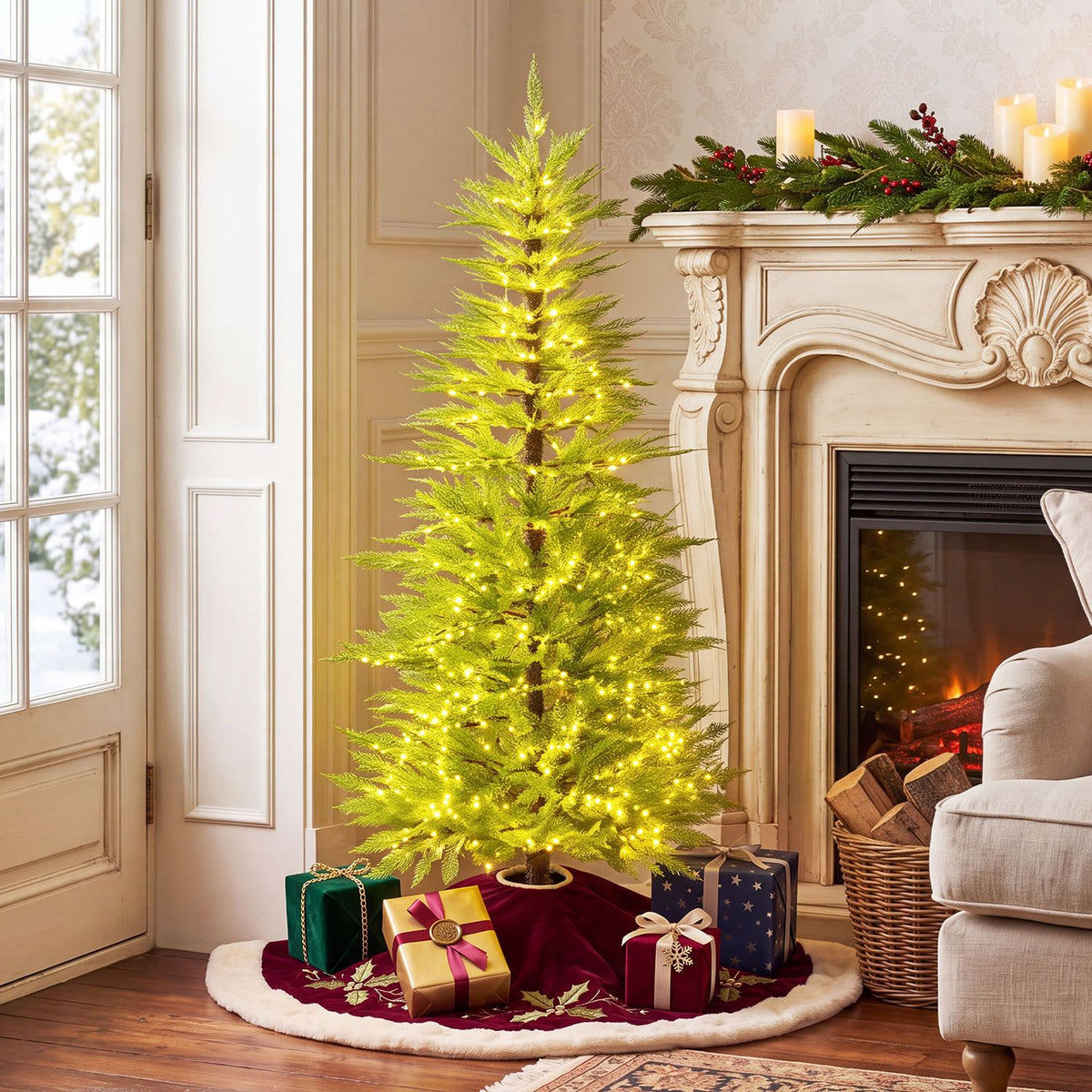 Glowing artificial Christmas tree beside a fireplace, surrounded by wrapped presents.