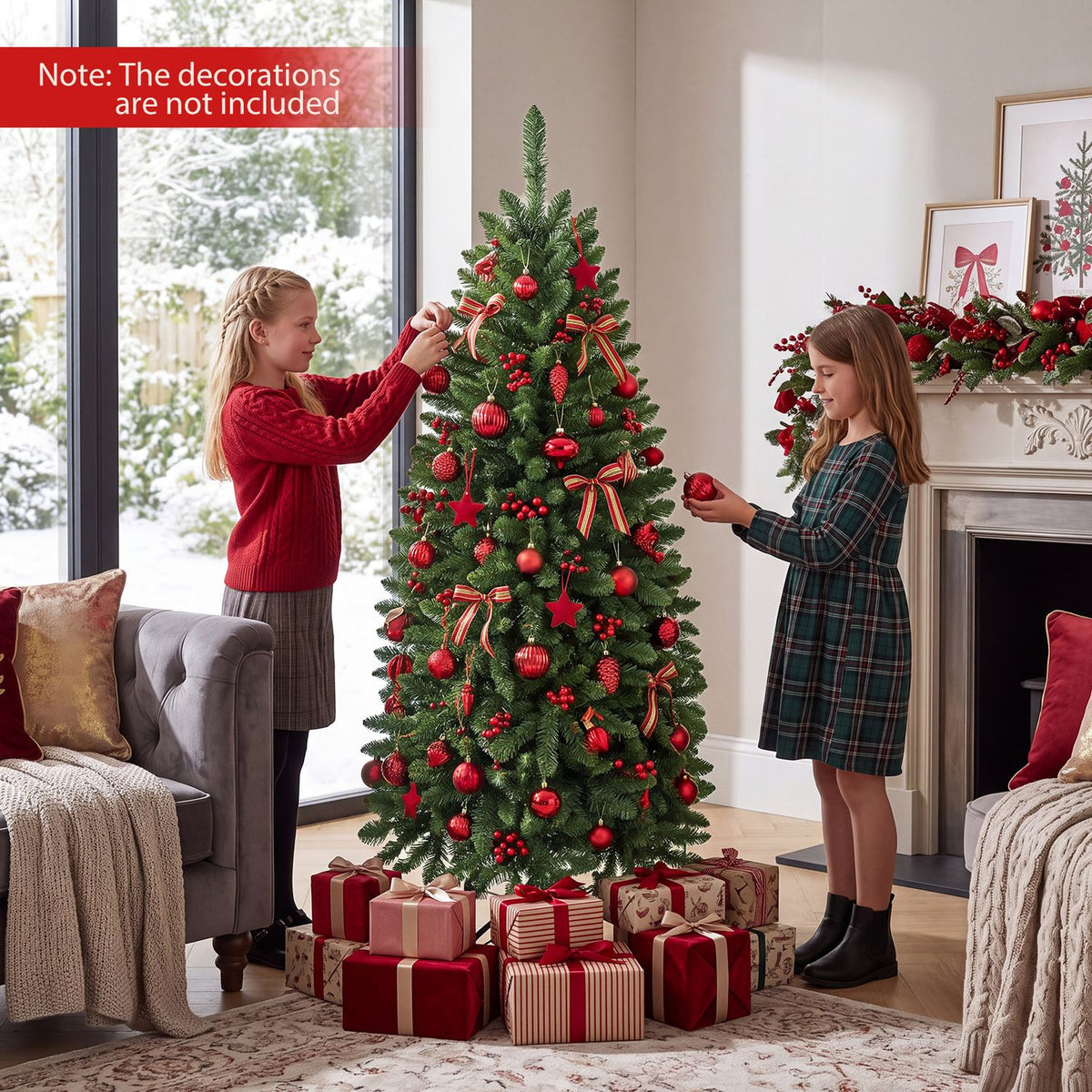 Two girls decorate a Christmas tree surrounded by wrapped gifts in a bright living room.