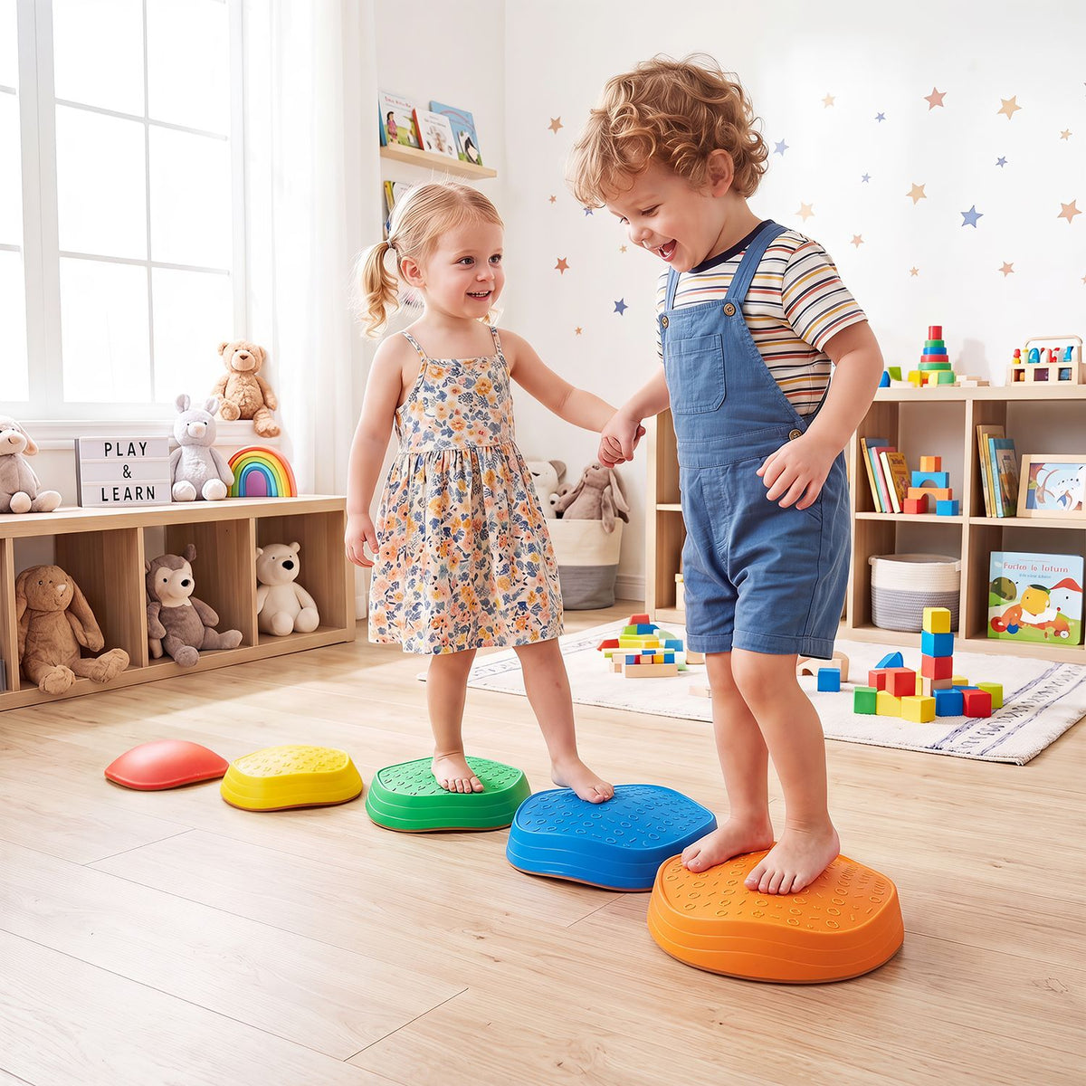 Two children step across five brightly colored, textured stones on a playroom floor.