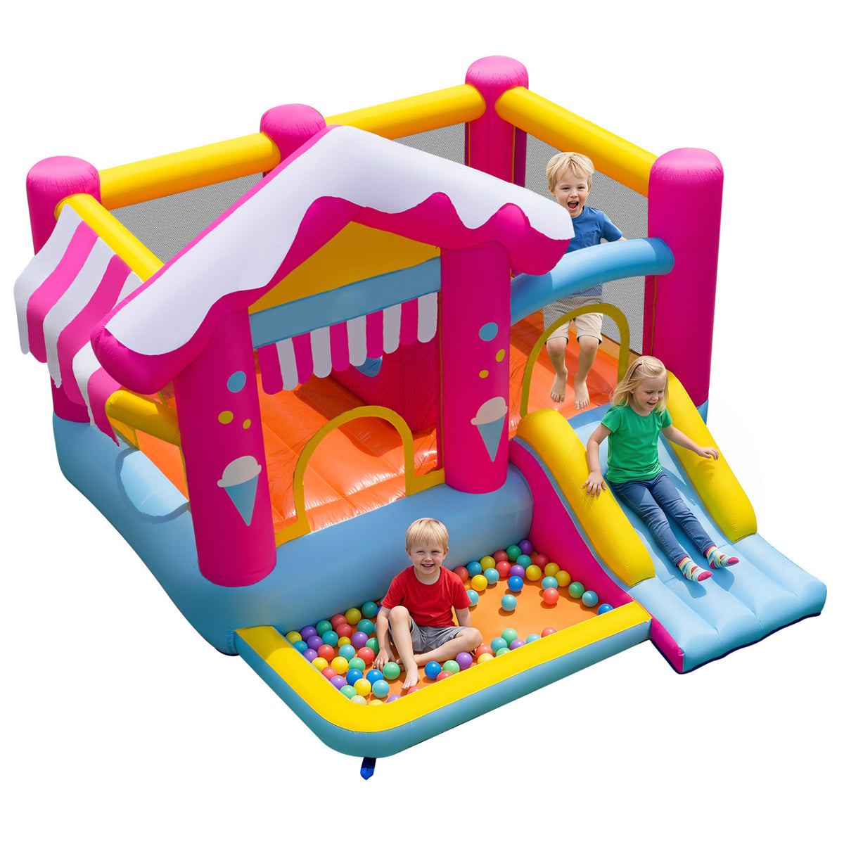 Children play in the inflatable house, with one sliding and another sitting among colorful balls in the pit.