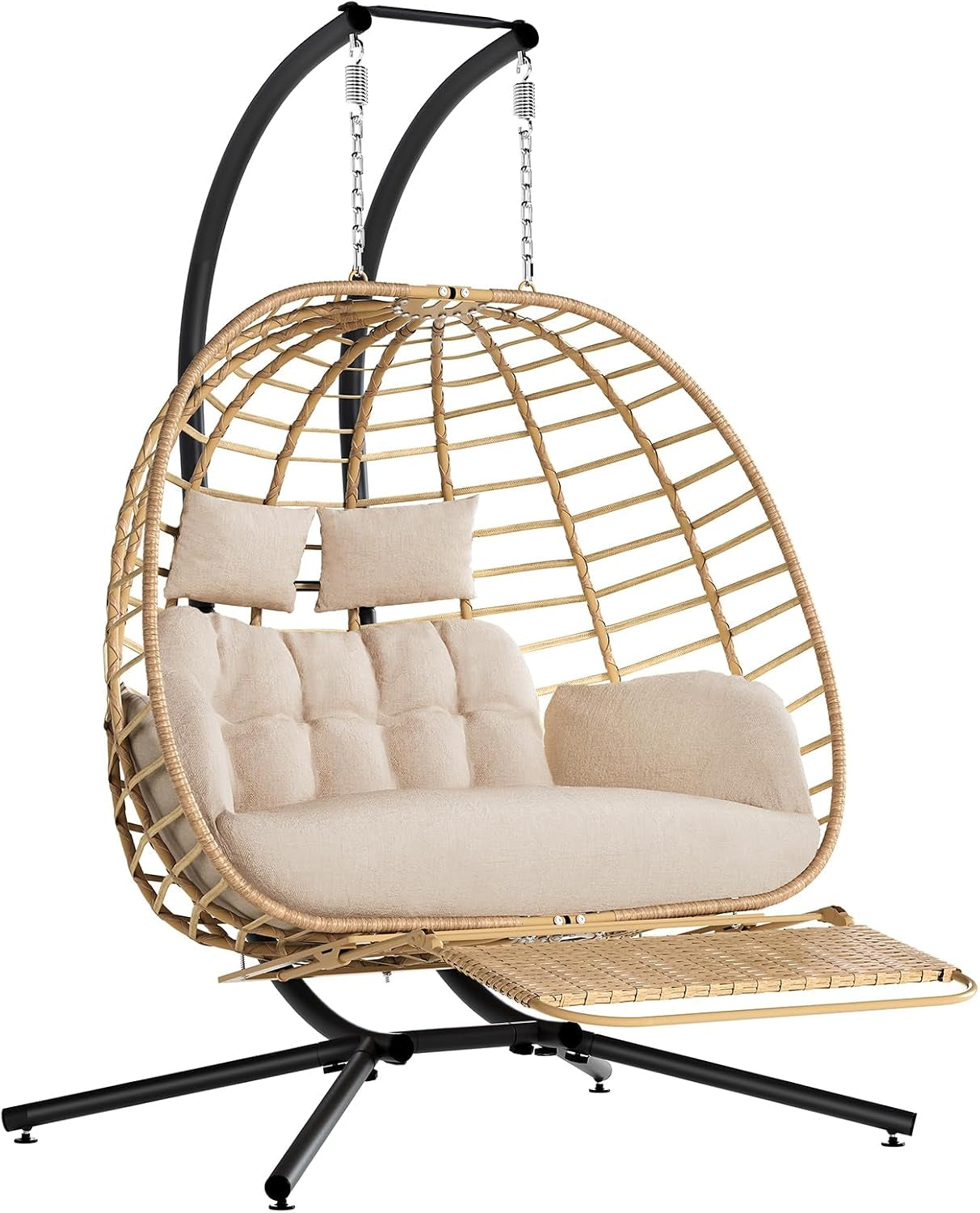 Front view of a tan wicker double egg hanging chair with beige cushions and black metal stand on white background.