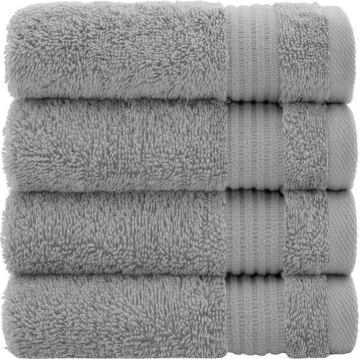 Four light gray towels stacked tightly to show dense terry loops and ribbed trim
