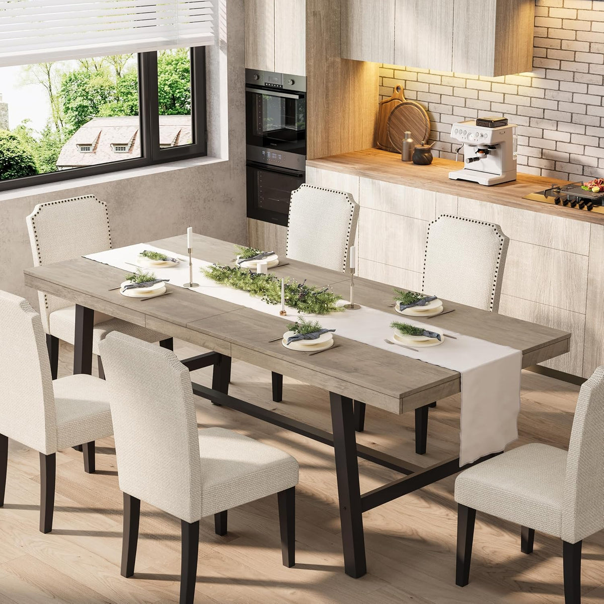 Neutral weathered wood top on black metal trestle base surrounded by upholstered dining chairs