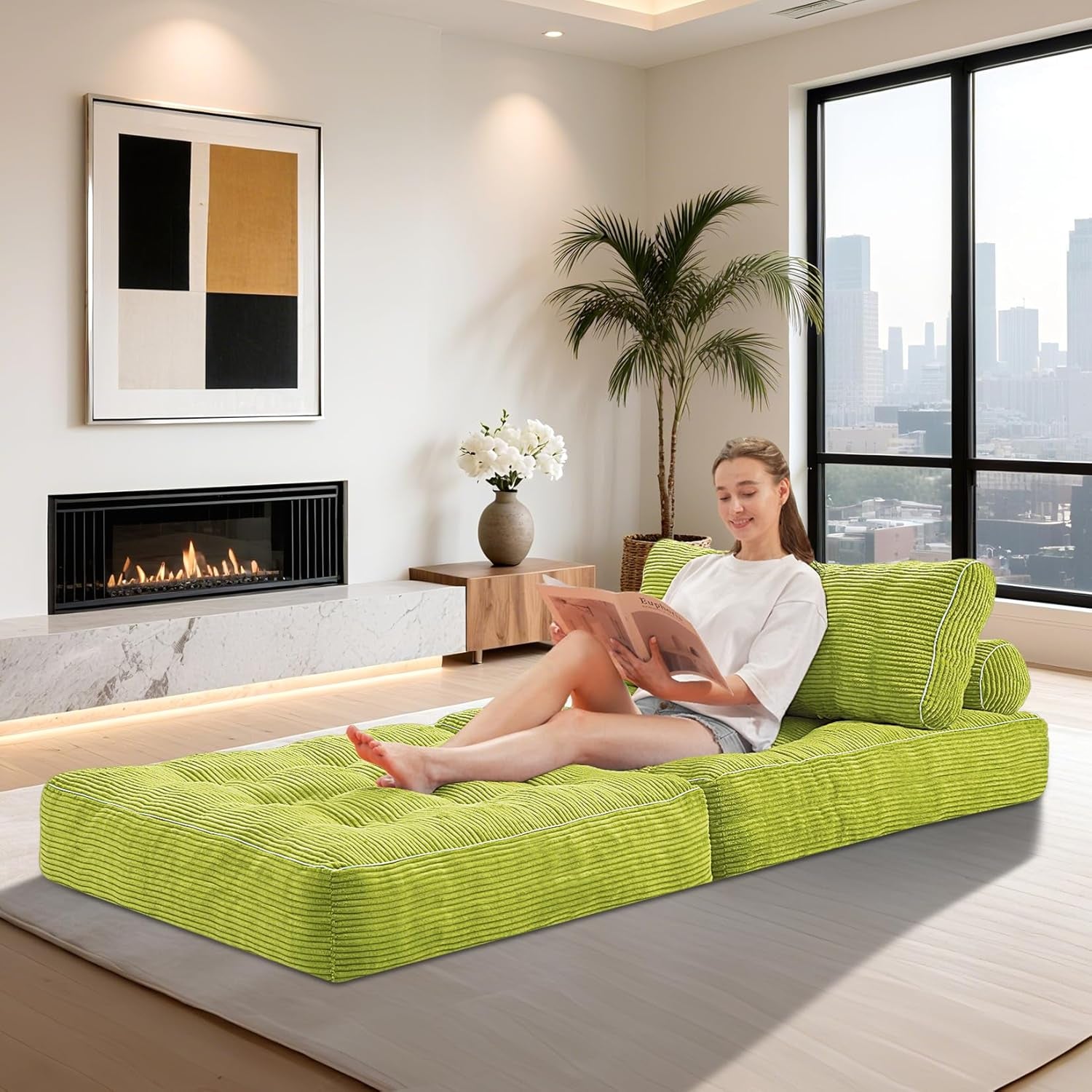 Woman lounging on unfolded green corduroy mattress mode in a bright living room