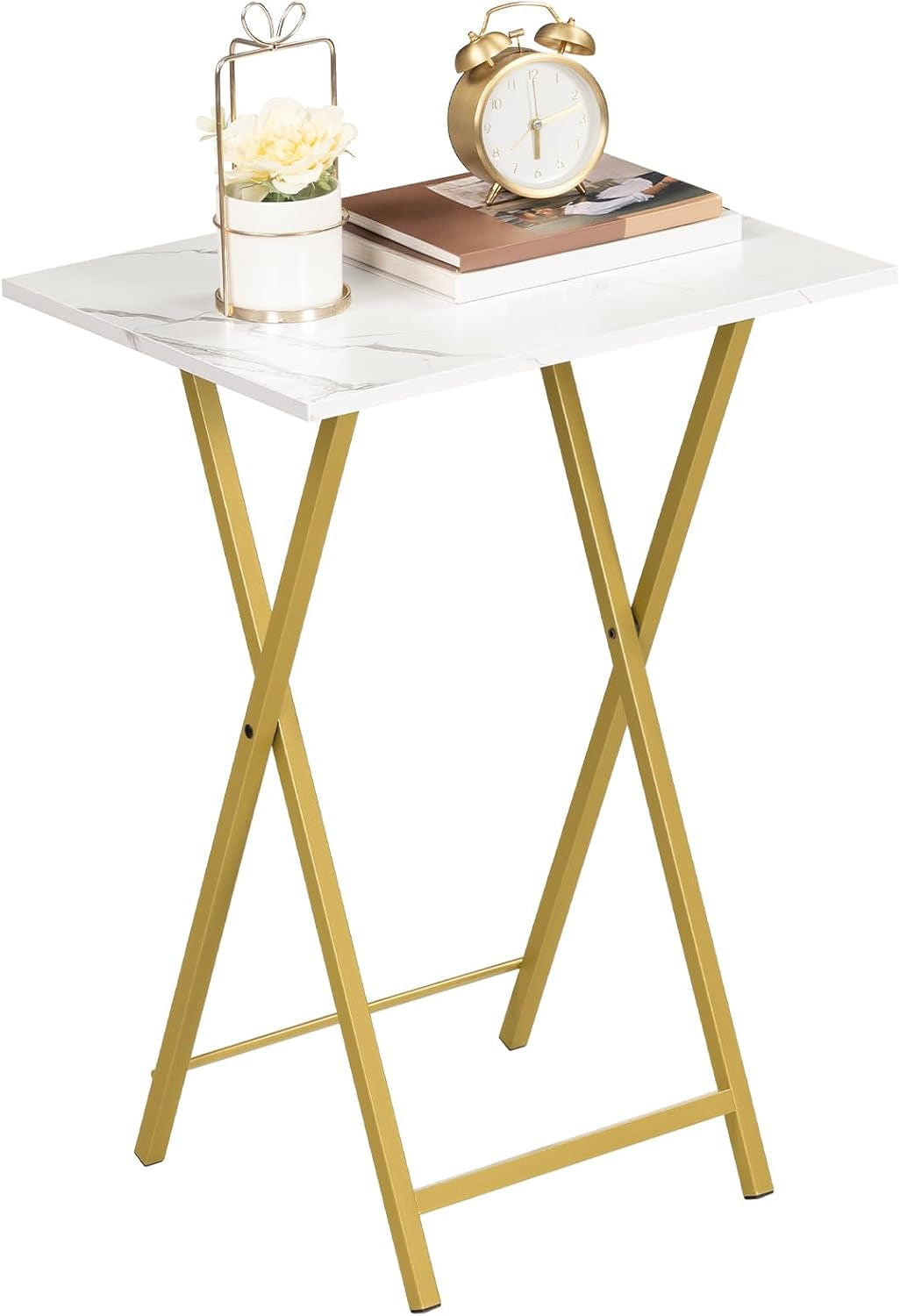 Single marble-top folding table with gold X-frame shown upright with clock and books on top
