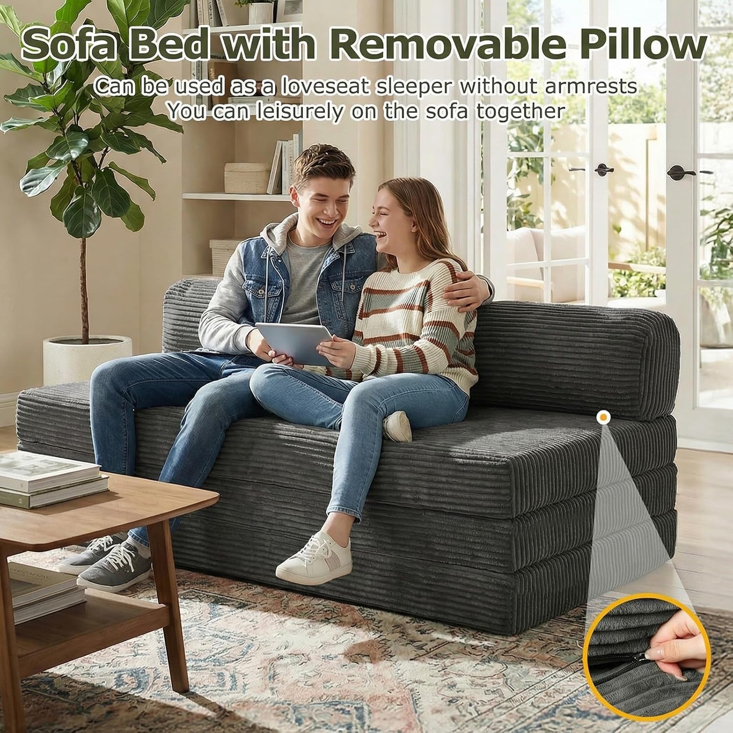 Couple sitting on grey loveseat showing removable pillow and hidden zipper detail