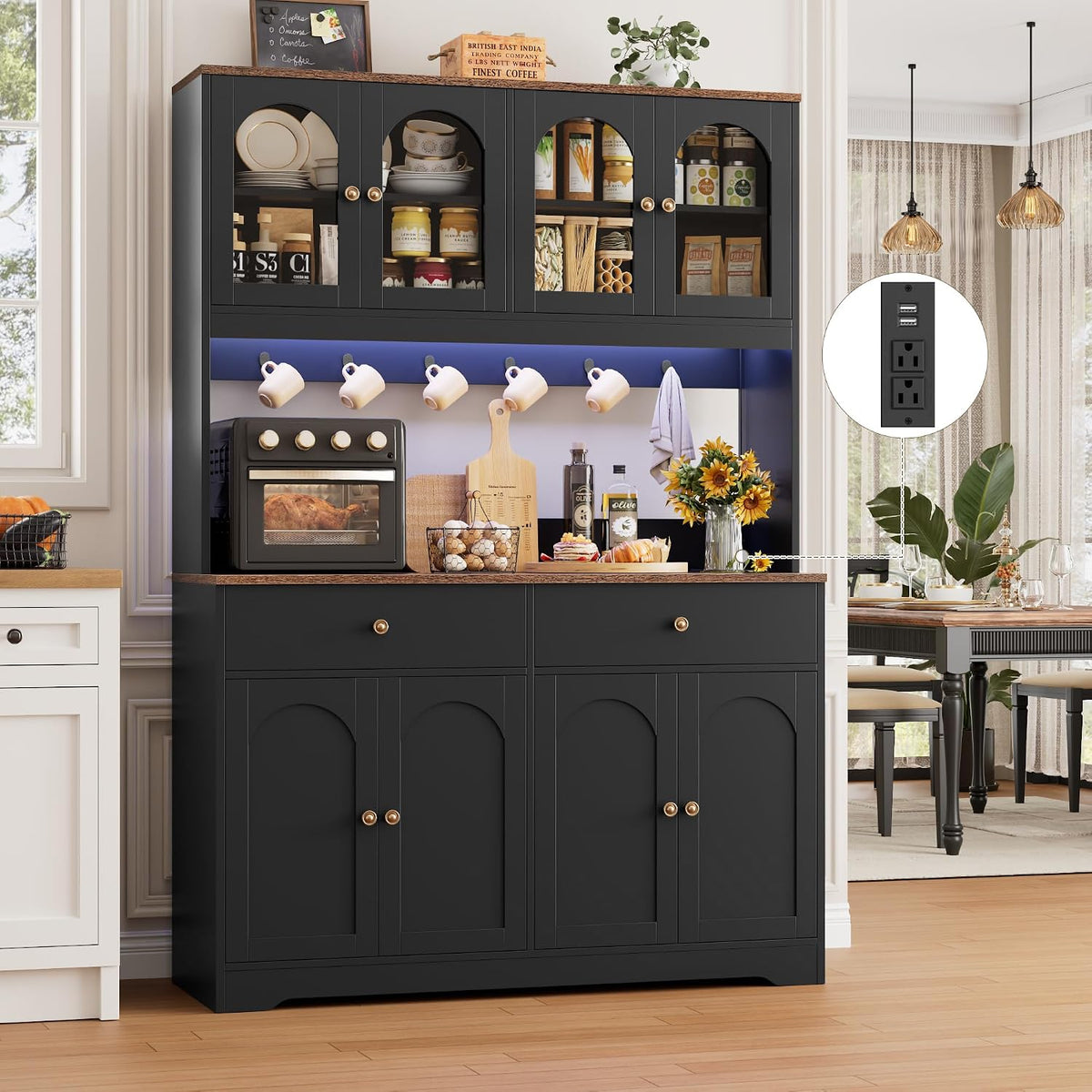 Styled kitchen view of black pantry with blue LED strip lighting, mugs on hooks and counter appliances