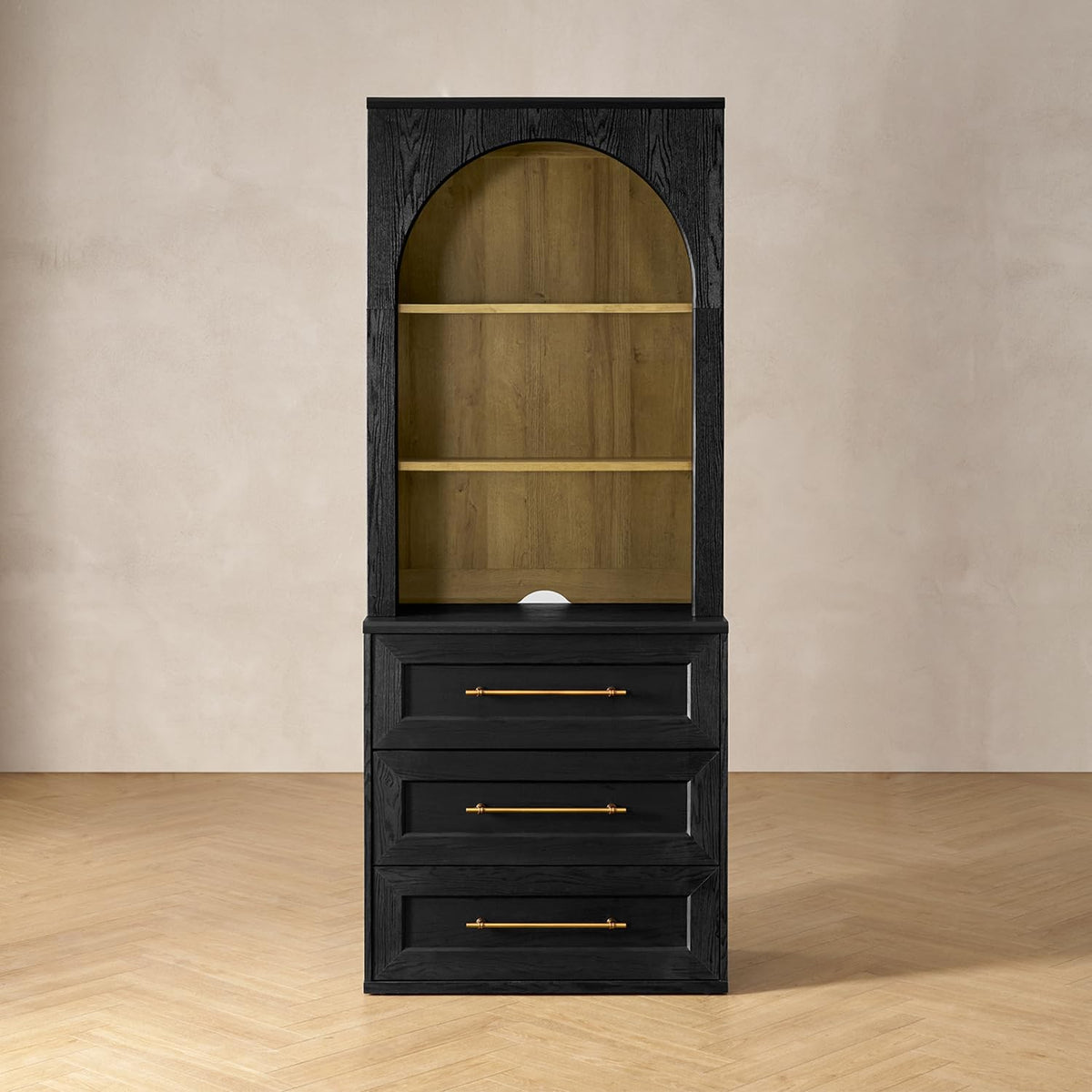 Front view of black tall storage cabinet with arched removable hutch and oak-finish interior shelves and three drawers