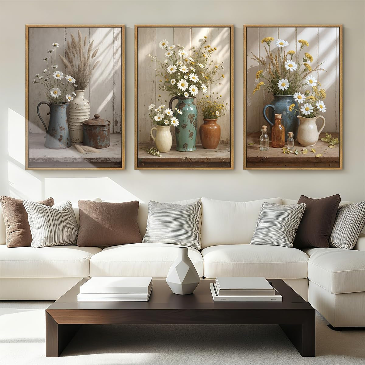 Living room with white sectional sofa and three framed botanical still-life prints above it