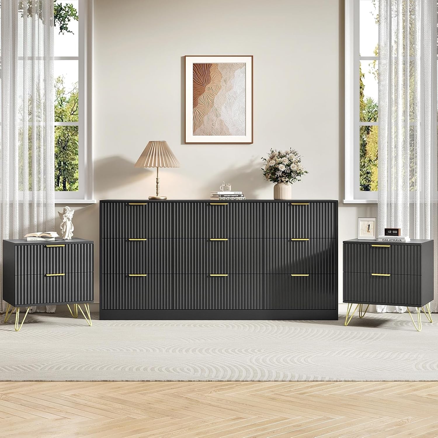 Charcoal/black seven-drawer dresser with matching nightstands and gold handles in a bright room.
