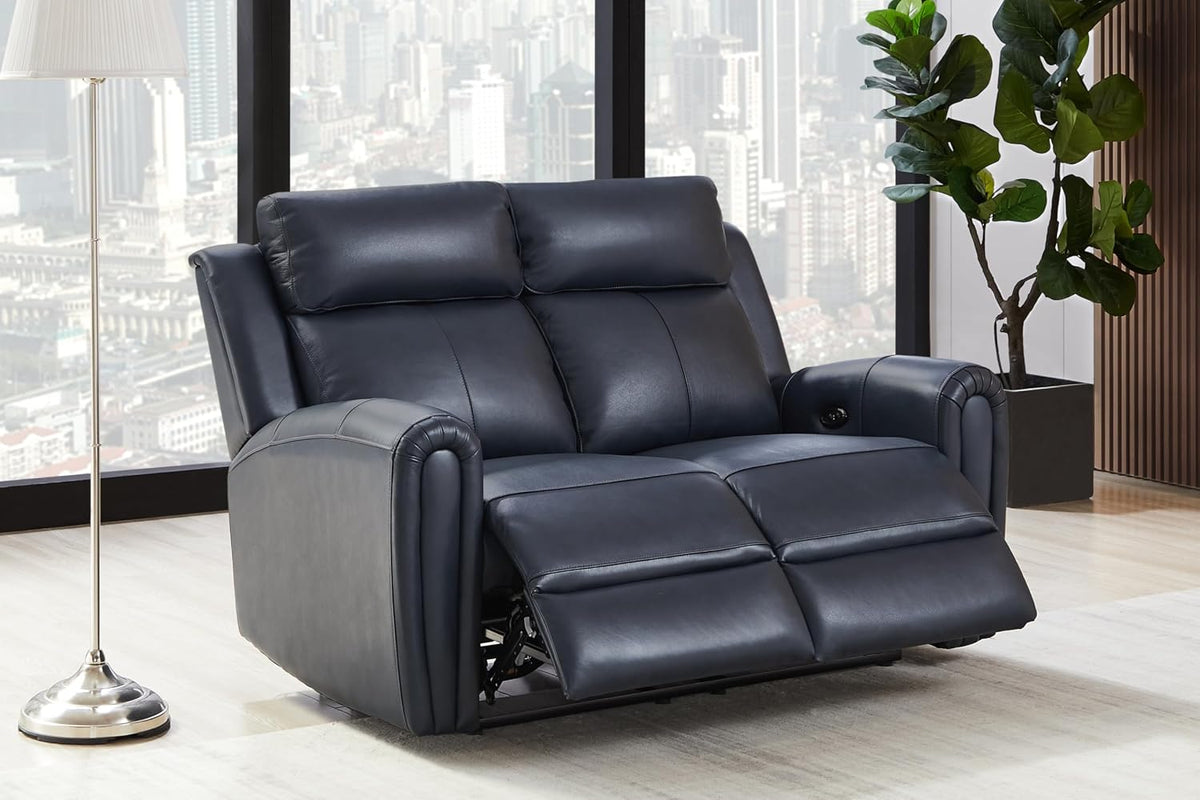 Close view of a navy leather reclining loveseat with footrests out and a visible round control button on the arm.