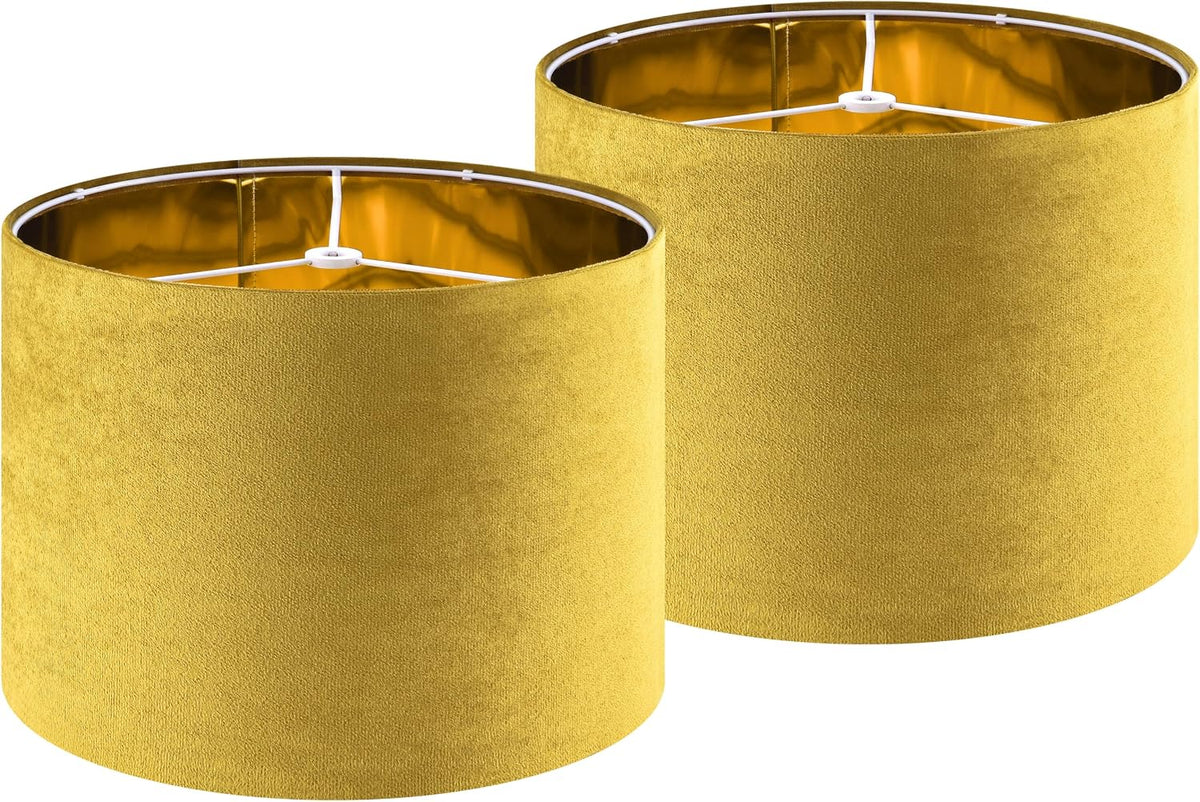 Two yellow drum lampshades side by side, showing gold inner lining and top spider fitters