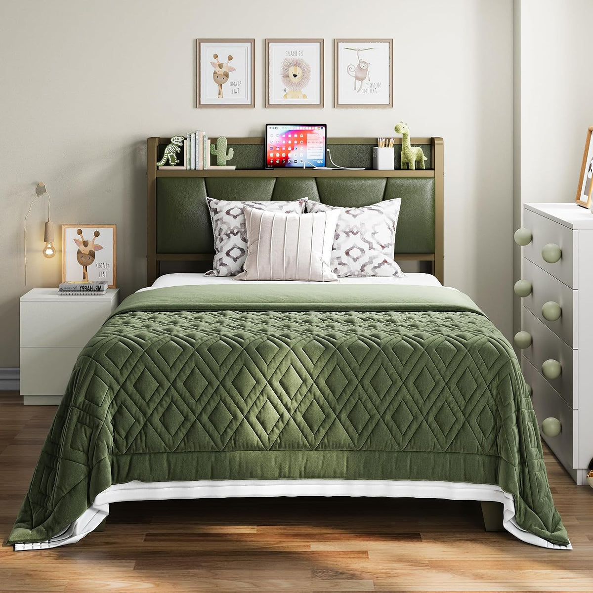 Compact bedroom scene showing a green-padded headboard with matching quilted green bedcover and white nightstand.