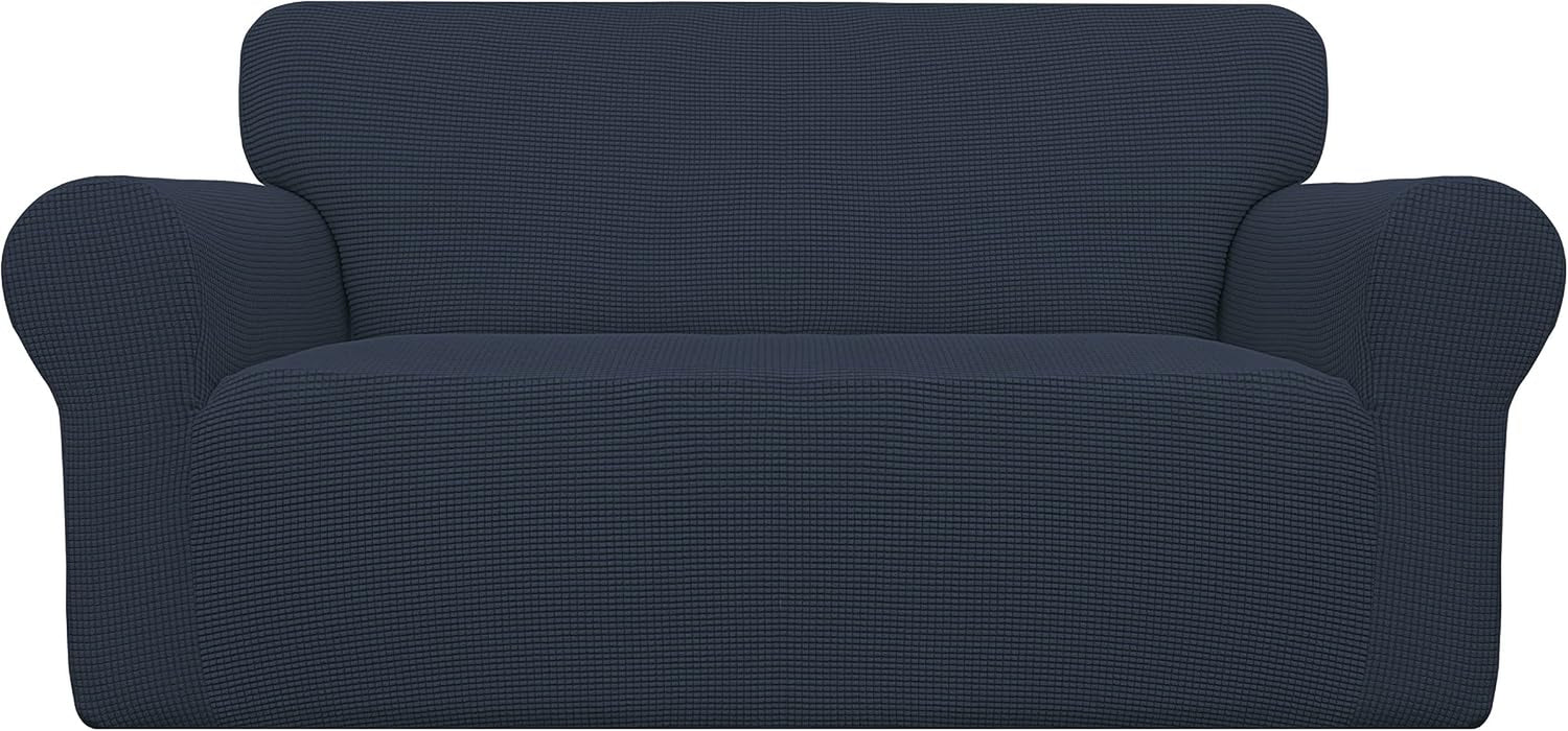 Front view of a loveseat fitted with a dark navy textured stretch slipcover over the entire sofa