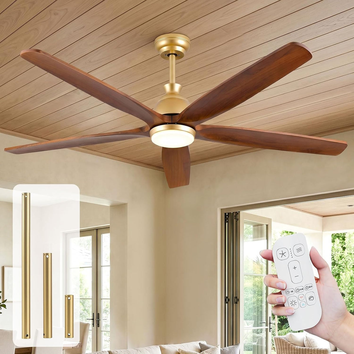 Walnut-blade ceiling fan with gold brass hardware, angled front view showing remote control and included downrod options in a