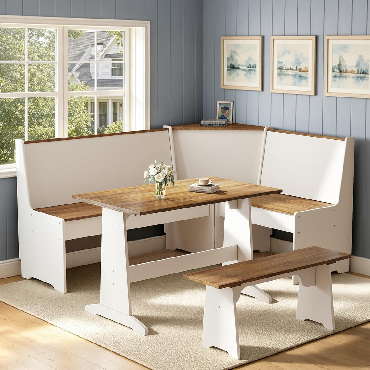 White barnwood corner dining set shown in a bright room with blue paneled wall and window