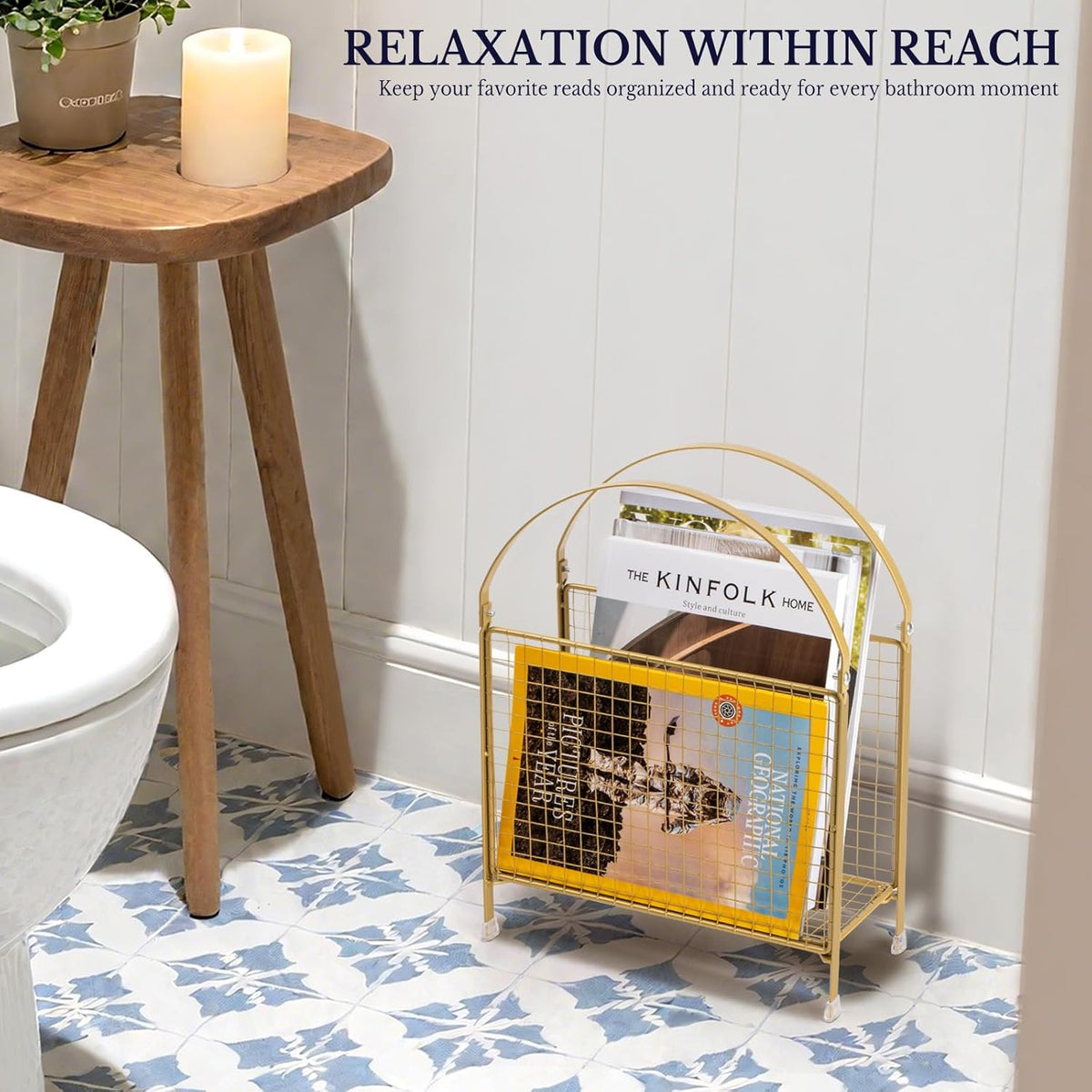 Gold handbag-style magazine rack on a bathroom floor next to a wooden stool and toilet holding magazines