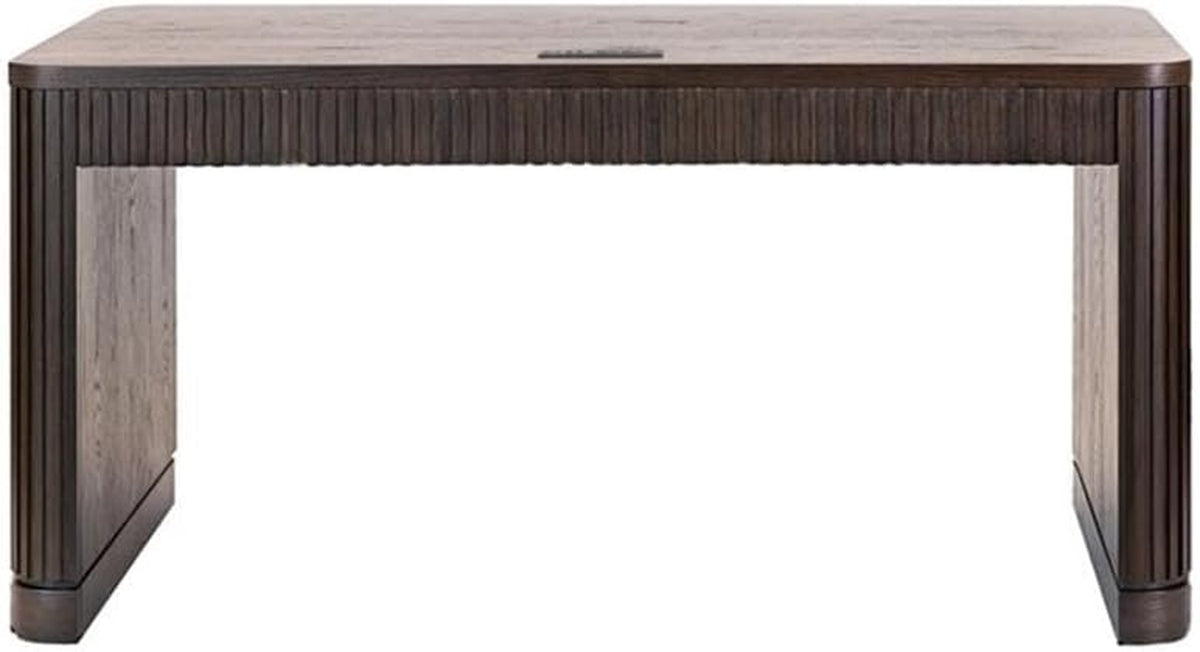 Straight-on view of a rectangular desk showing a center cable grommet on the top and thick panel legs.