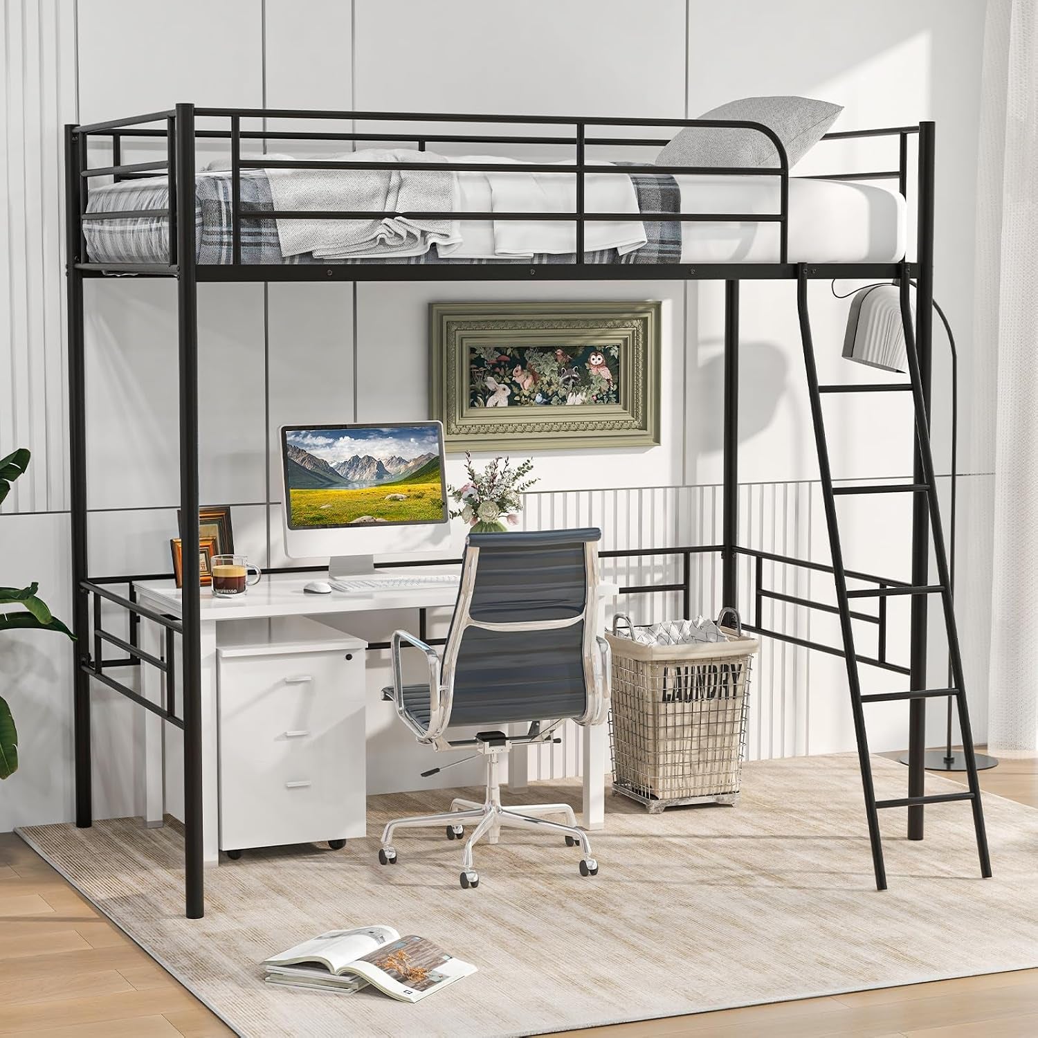Black metal twin loft bed with right-side ladder over a workspace desk, chair, monitor and laundry basket