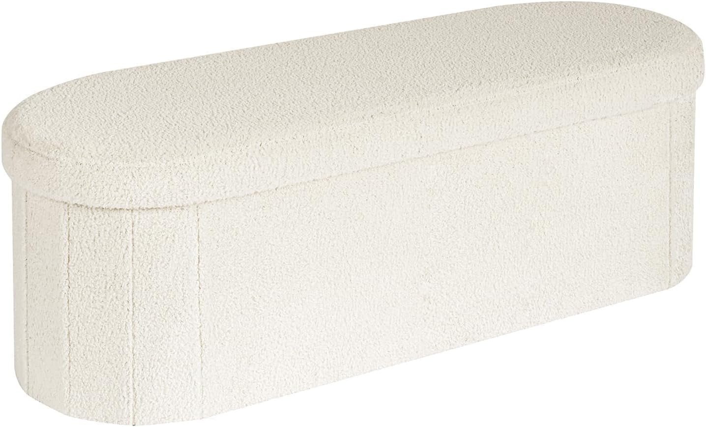 White sherpa oval storage ottoman angled front view on white background
